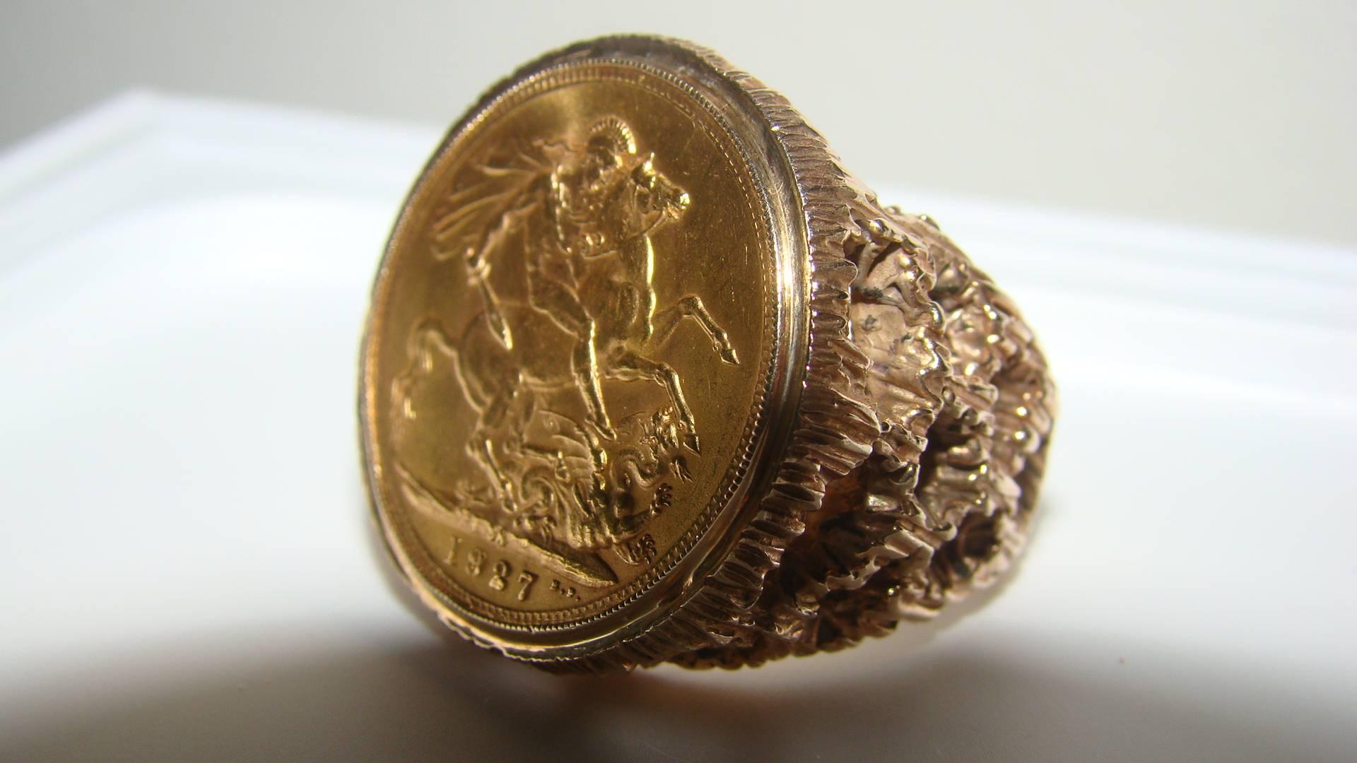 Beautiful 1927 22-karat British full sovereign coin ring. This ring is quite large and heavy comprised of an original 1927 full sovereign 22-karat solid gold coin with 18-karat solid gold sculptural housing. It weighs over 22 grams and appears to be