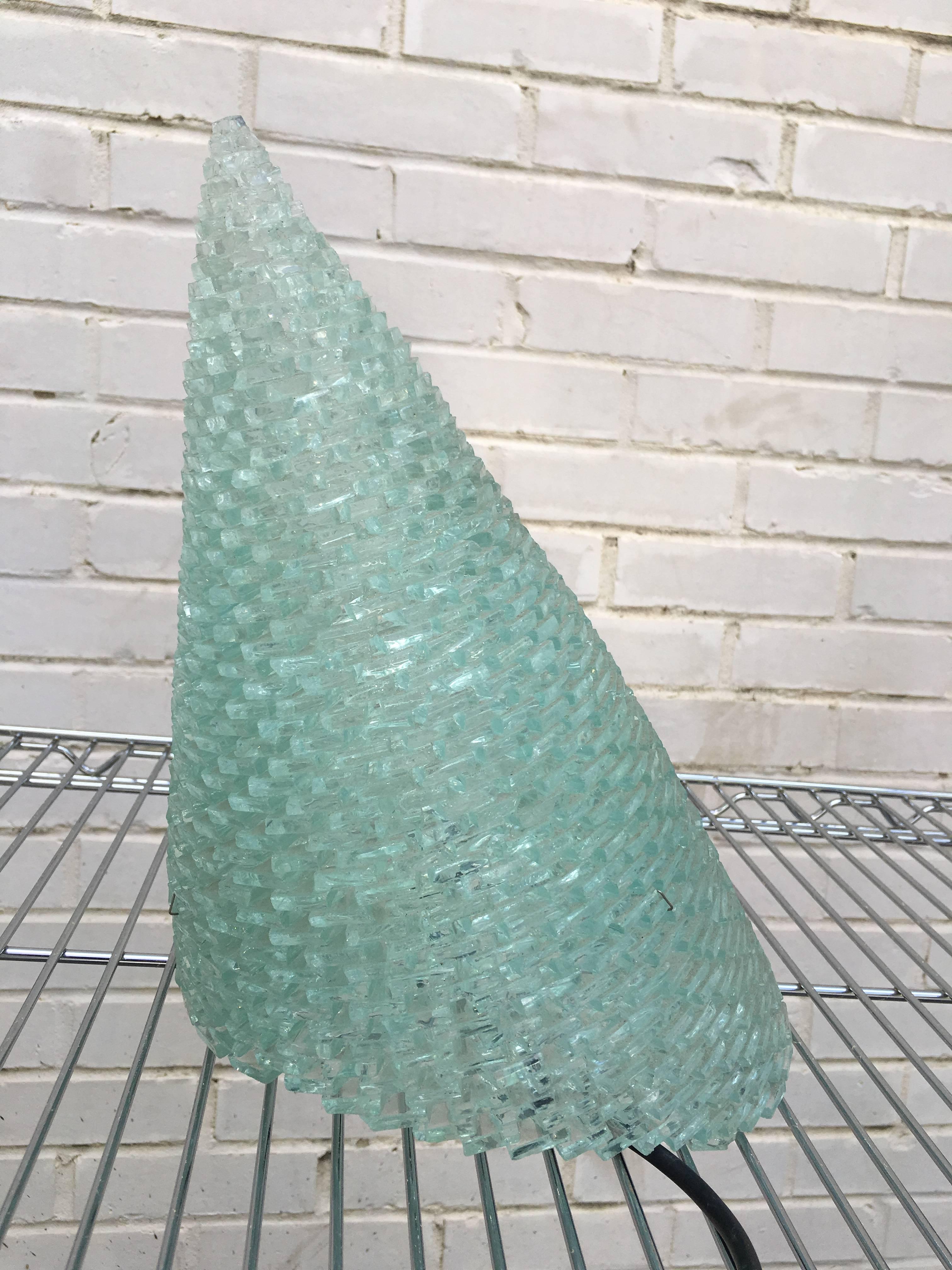 Exceptional Italian glass block cone table lamp. This unusual design is comprised of tiny glass pieces which form a slanted cone design. Bulb is Halogen. Truly a unique lamp for any decor.