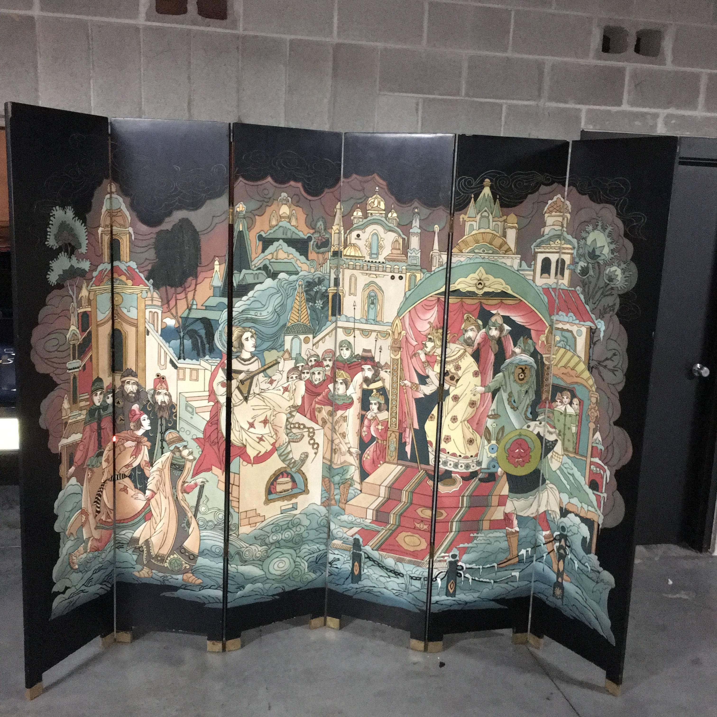 Terrific vintage decorative lacquered six-panel Chinese screen. This beautiful piece is comprised of black lacquered wood with colorful decorative hand-painted and guided designs. Brass feet adorn the bottom.