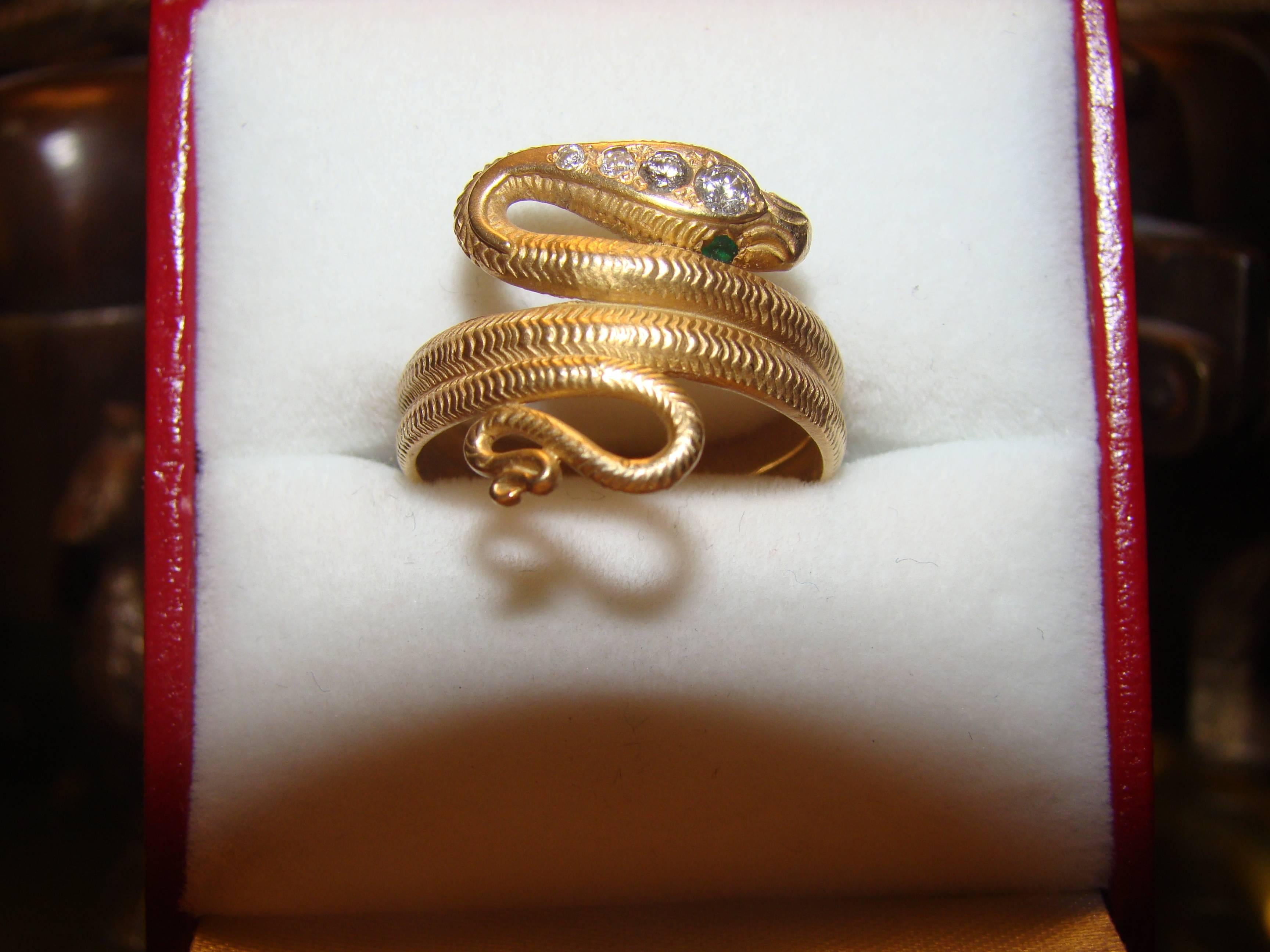 This beautiful antique Art Deco 18 karat yellow gold snake ring has beautiful texture, and it's head is mounted with four diamonds, and has two emerald eyes. The Vintage Diamonds are around VS 1 quality and very bright. Truly a unique ring in