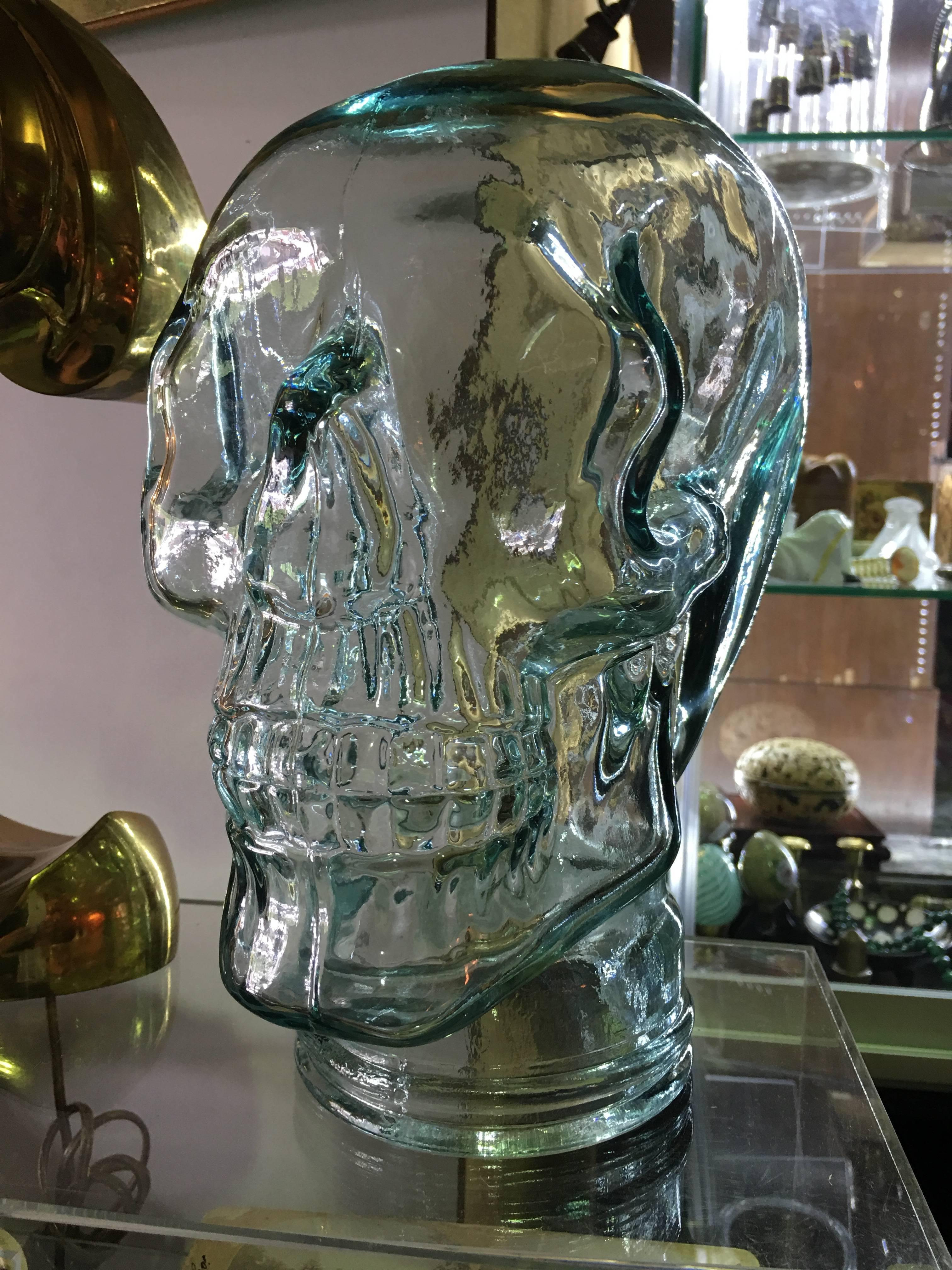 Terrific sculptural glass full size skull. Comprised of blown glass with green tint. Great piece of artwork for your collection.