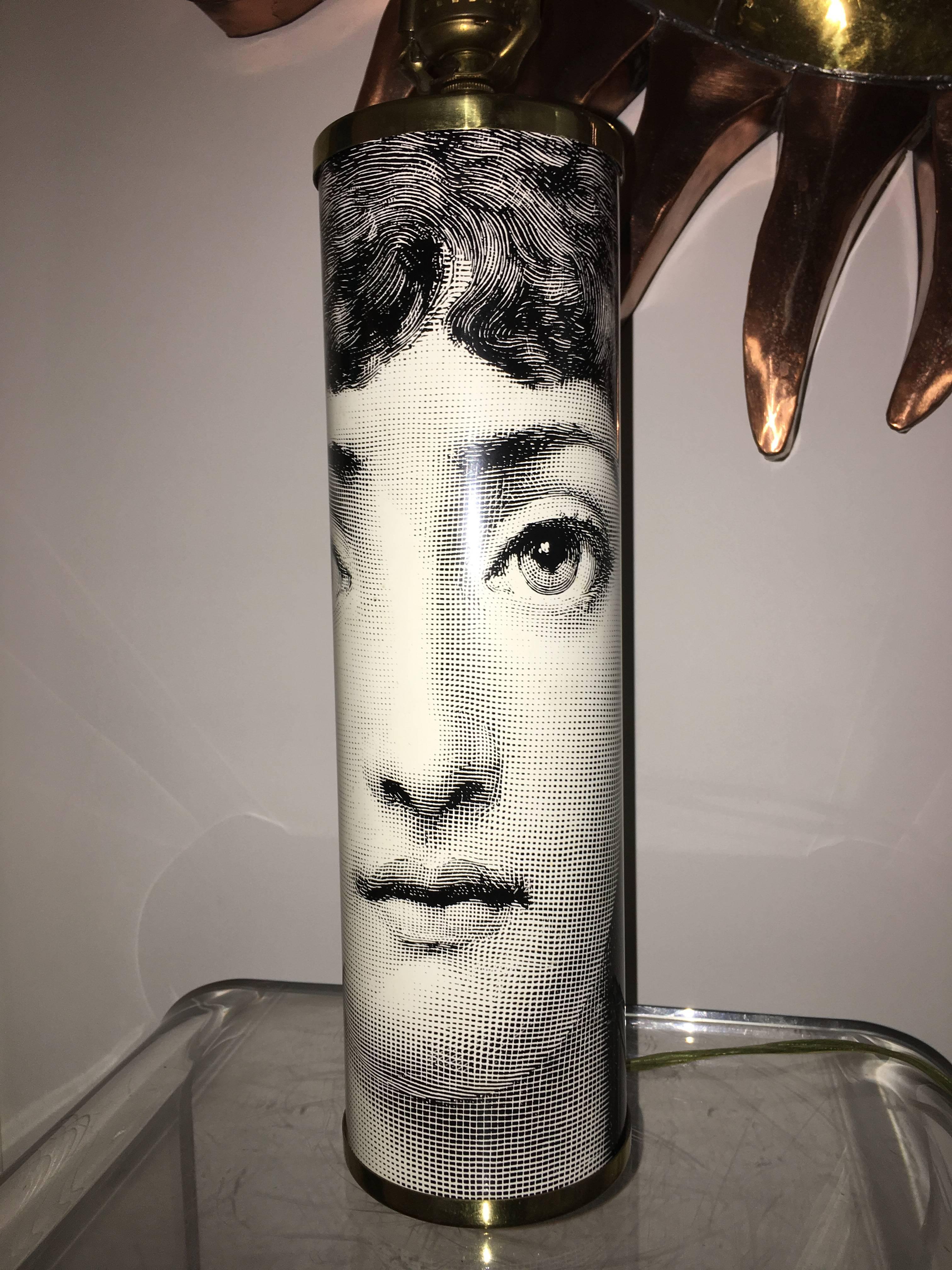 Exceptional vintage Julia table lamp by Piero Fornasetti. This Classic design features the black and white face with brass hardware. Signed Fornasetti in two locations. Comes with brass harp and finial. Guaranteed authentic.