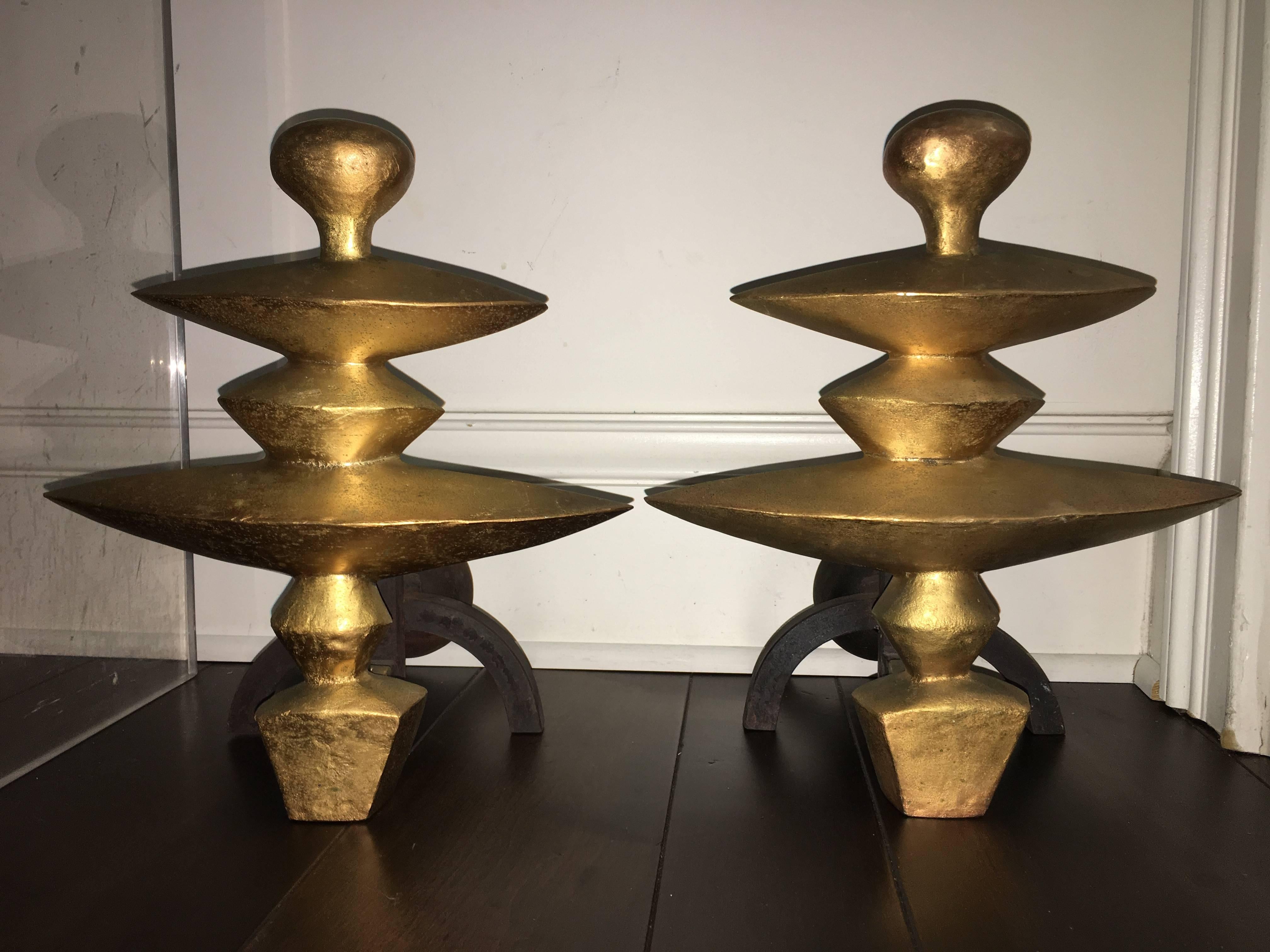 A pair of hard to find Andirons designed by Giacometti and produced in 1978 for Nelson Rockefeller Collection. Comprised of gold gilded bronze with iron back weights. Signed and dated C 1978 NR.