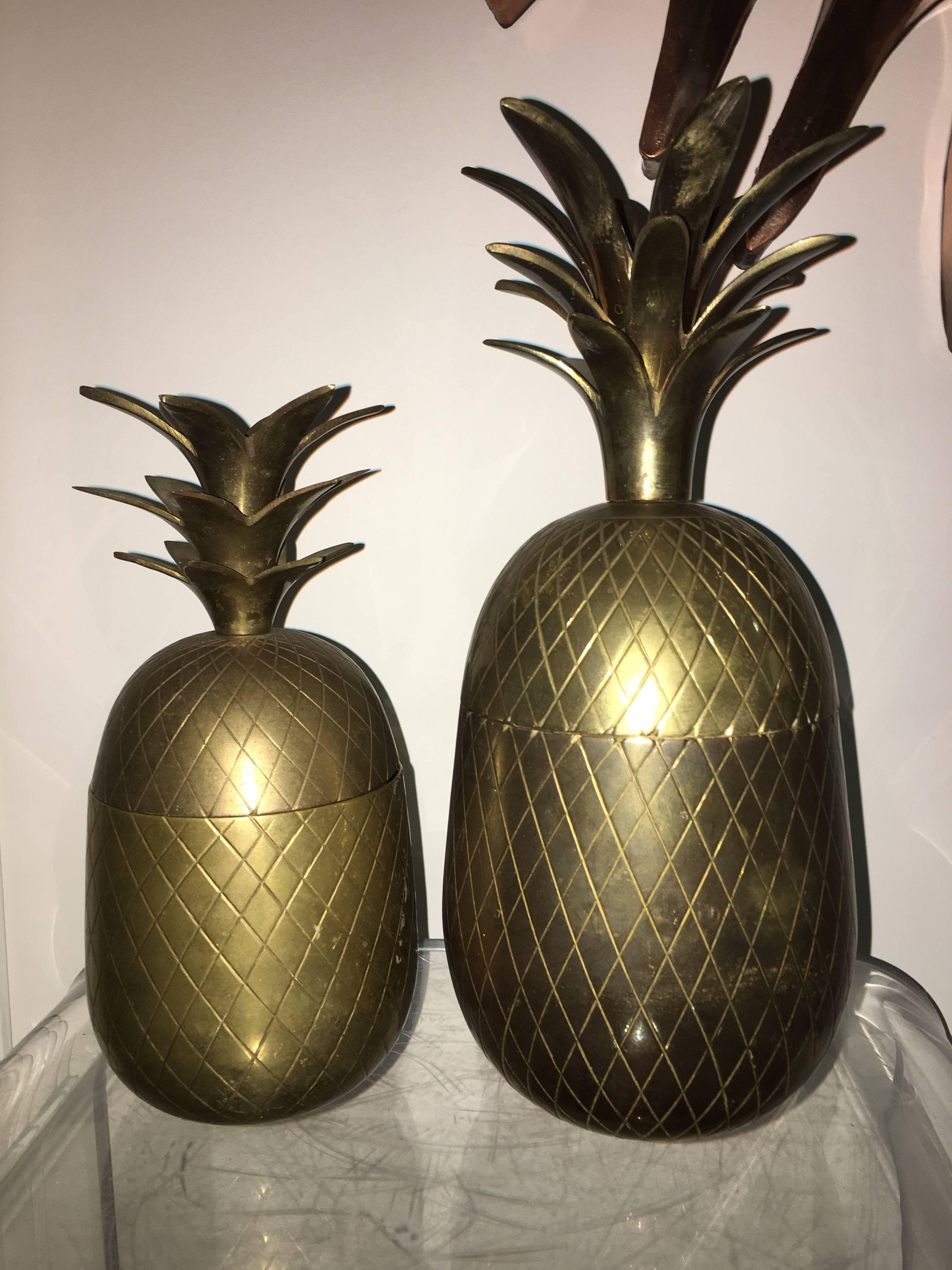 Great pair of brass sculptural pineapple lidded boxes or ice buckets. One is larger 12