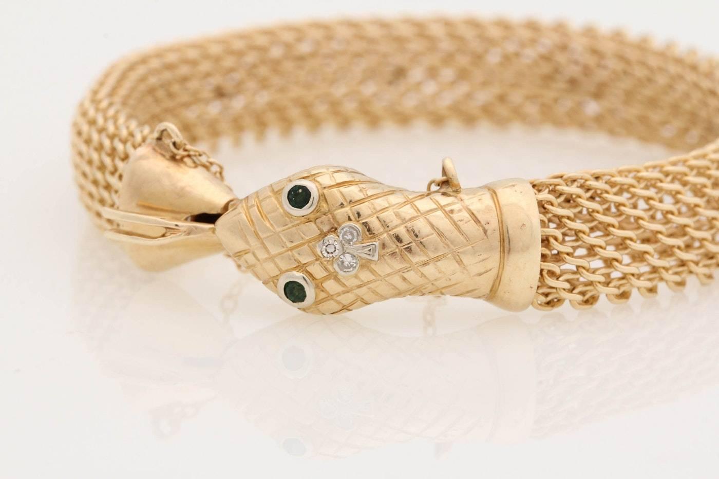 Beautiful vintage 14-karat yellow gold diamond and emerald snake bracelet. This bracelet displays the concept of infinity or wholeness as symbolized by the snake swallowing its tail

Metal type: 14-karat yellow gold
Bracelet length:
