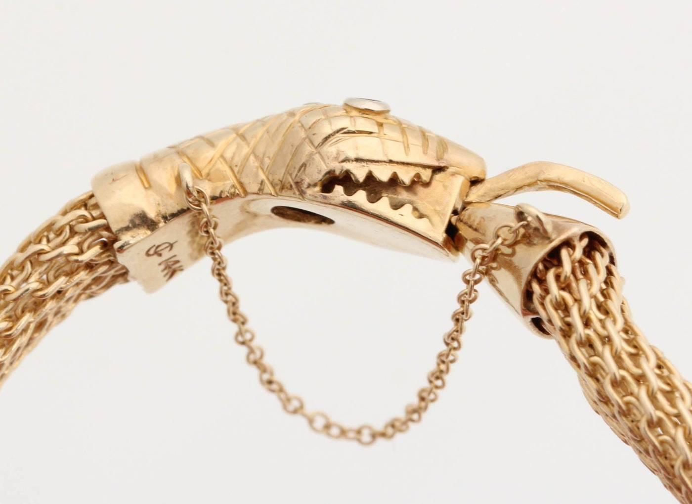 14-Karat Gold Snake Bracelet with Emerald Eyes and Diamonds In Excellent Condition For Sale In Atlanta, GA