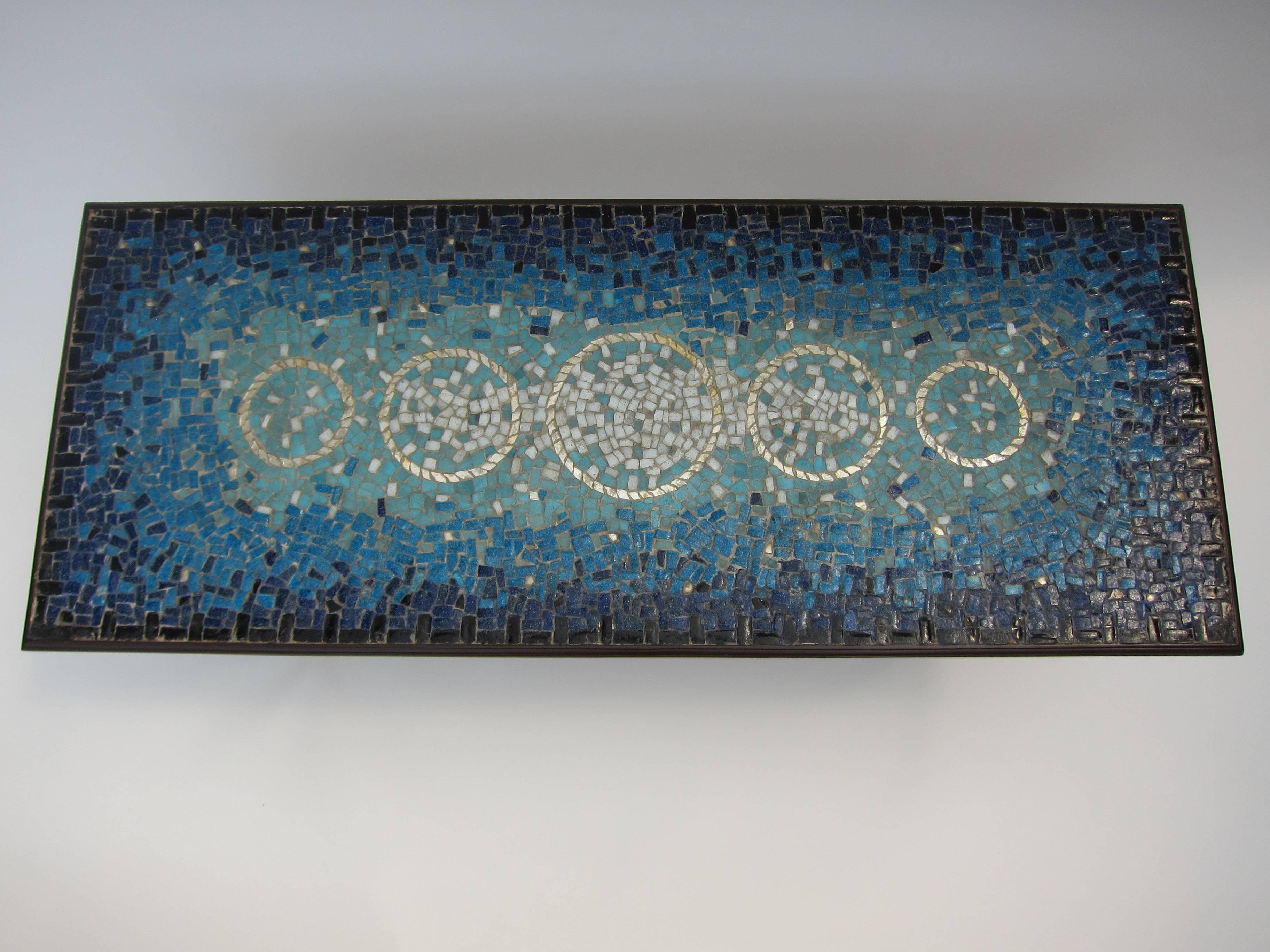 The Mexican modernist, Genaro Alvarez, is a name synonymous with excellence in mosaic craft and artistic expression. Whether it be murals or panels in furniture, Genaro was the master of mosaic craft here in Mid-Century Mexico. In this example,