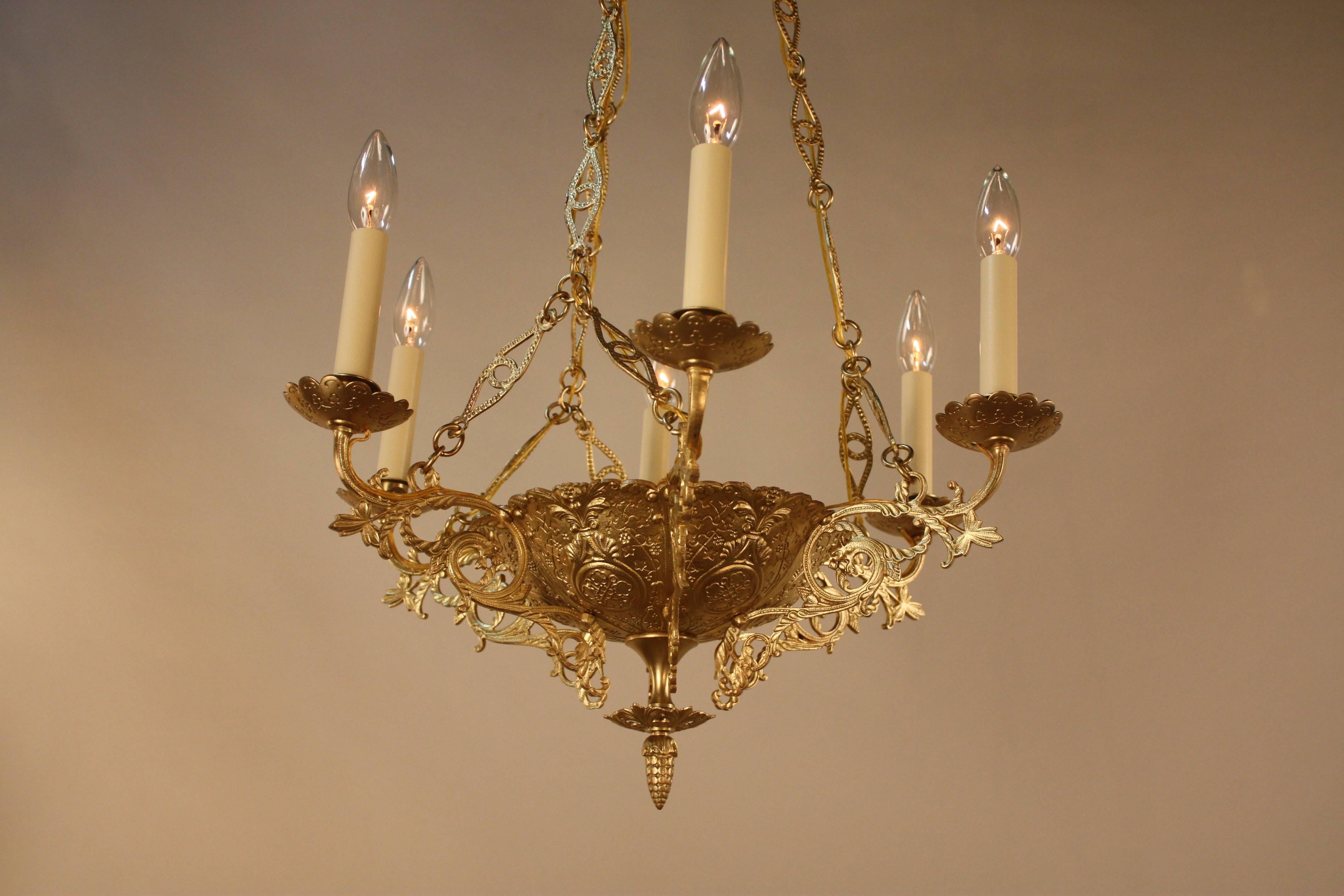 19th century six-light bronze chandelier. Originally burning candle that professionally has been electrified.