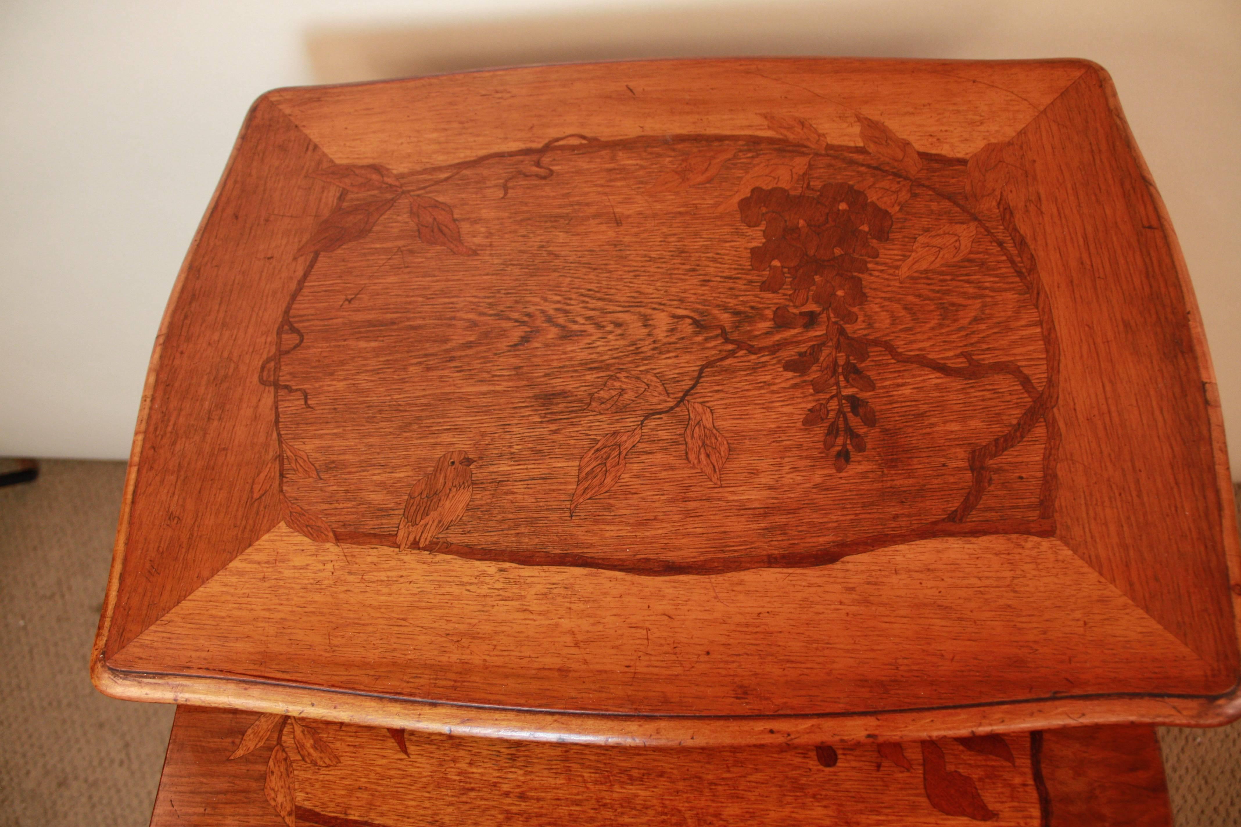 Set of four French inlaid top Art Nouveau nesting tables.