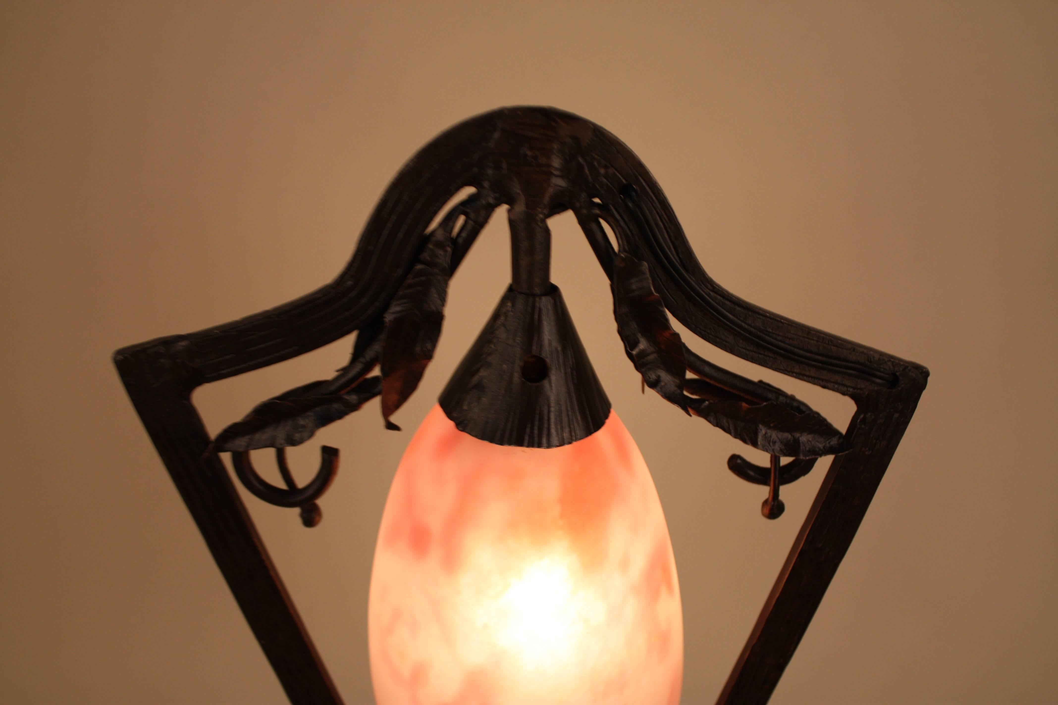 Outstanding Art Nouveau handblown glass and wrought iron table lamp by Daum Nancy.