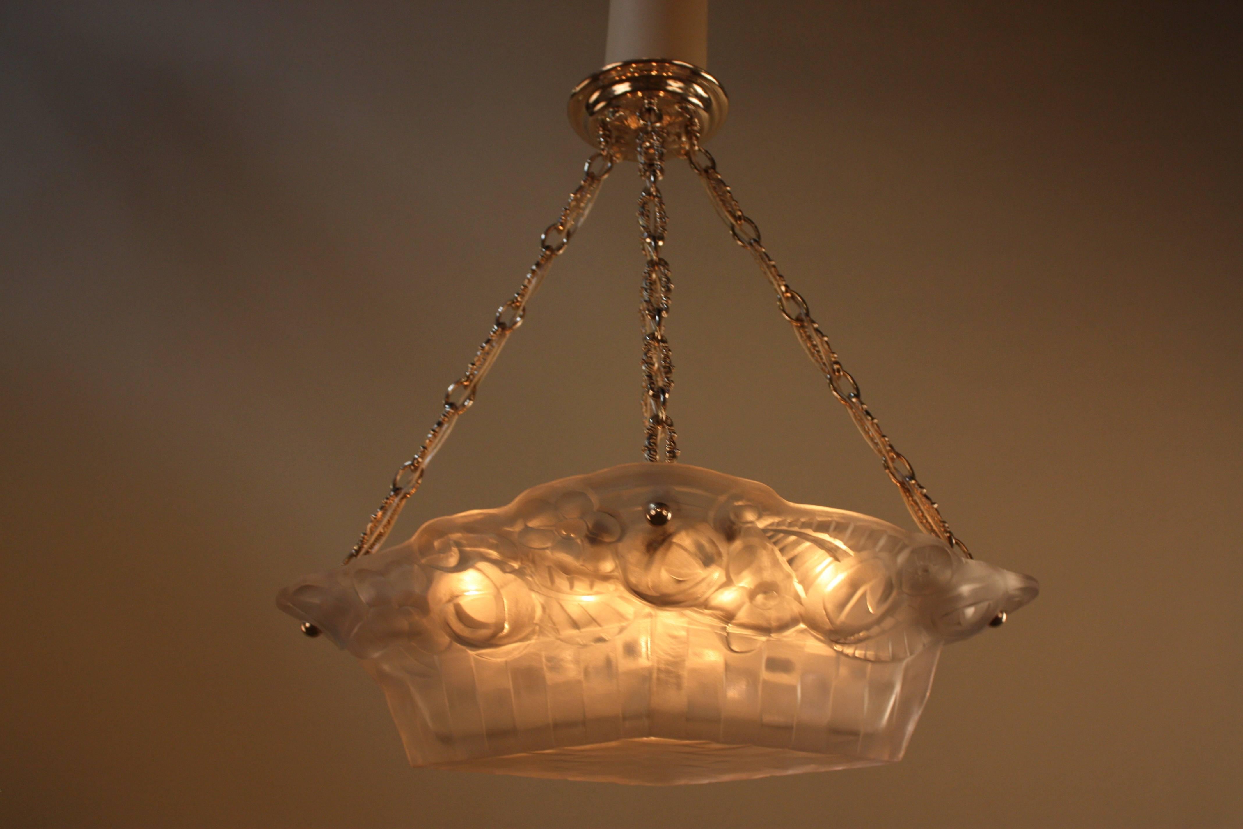 Elegant diamond shape glass basket design ten light chandelier with nickel on bronze hardware.