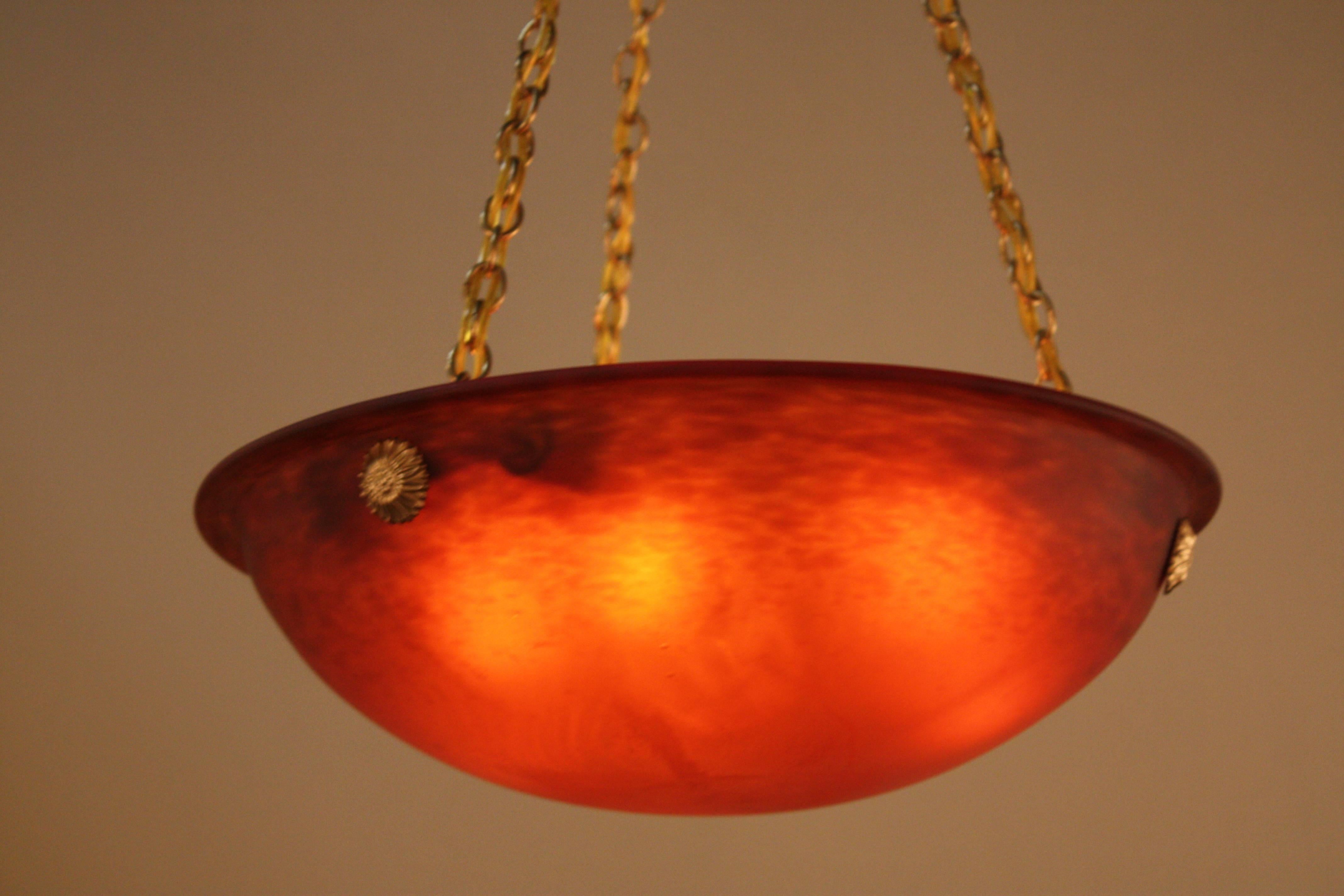 Handblown glass chandelier in beautiful textured red and bronze hardware.
Six lights, 60watts each.
Height can be adjusted by removing some of the chain.
