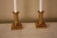 Pair of Neoclassical Electrified Bronze Candlestick Lamps by Cailar Bayard