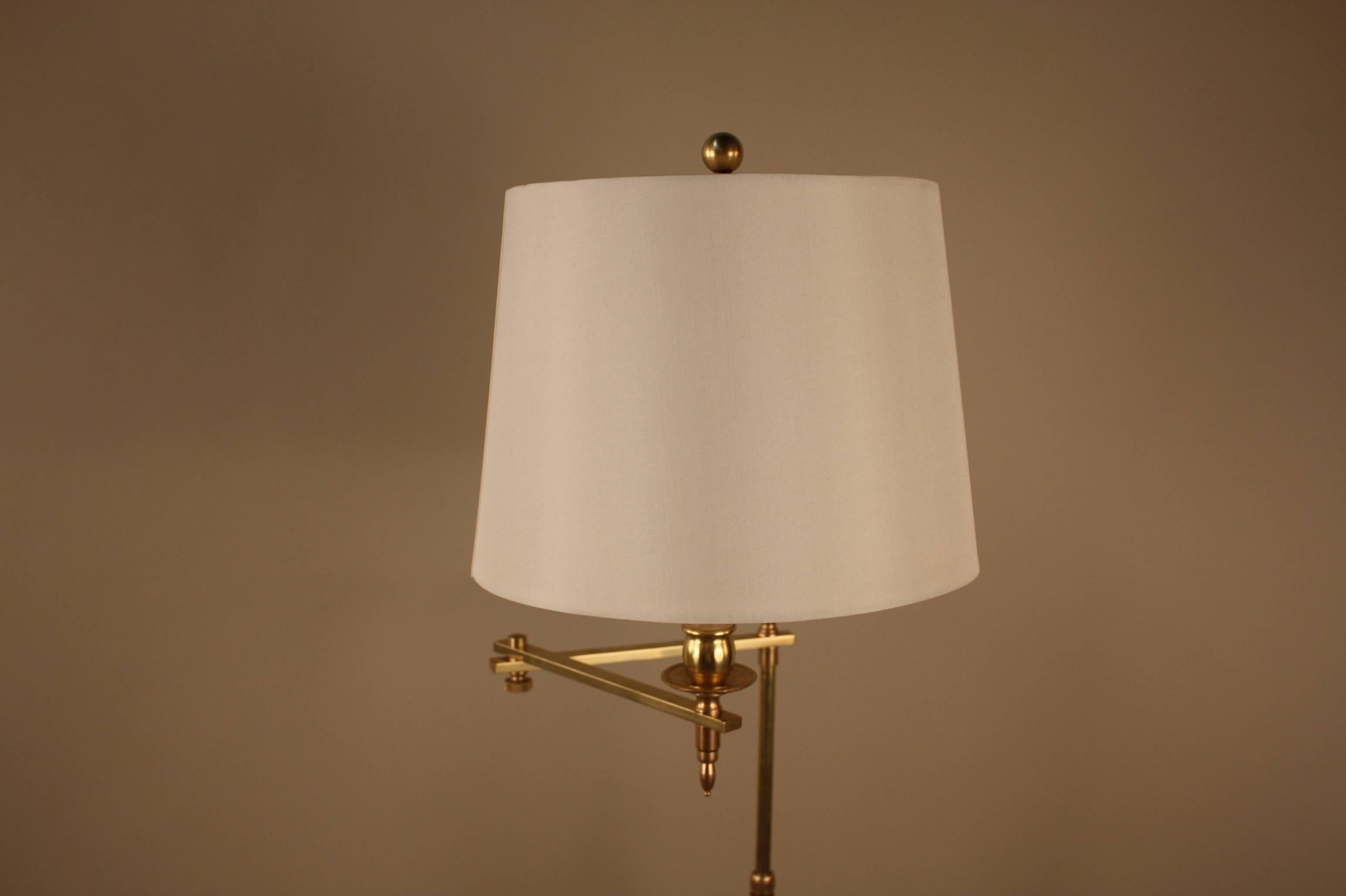Simple but elegant swing arm adjustable height bronze floor lamp.
Height is 58