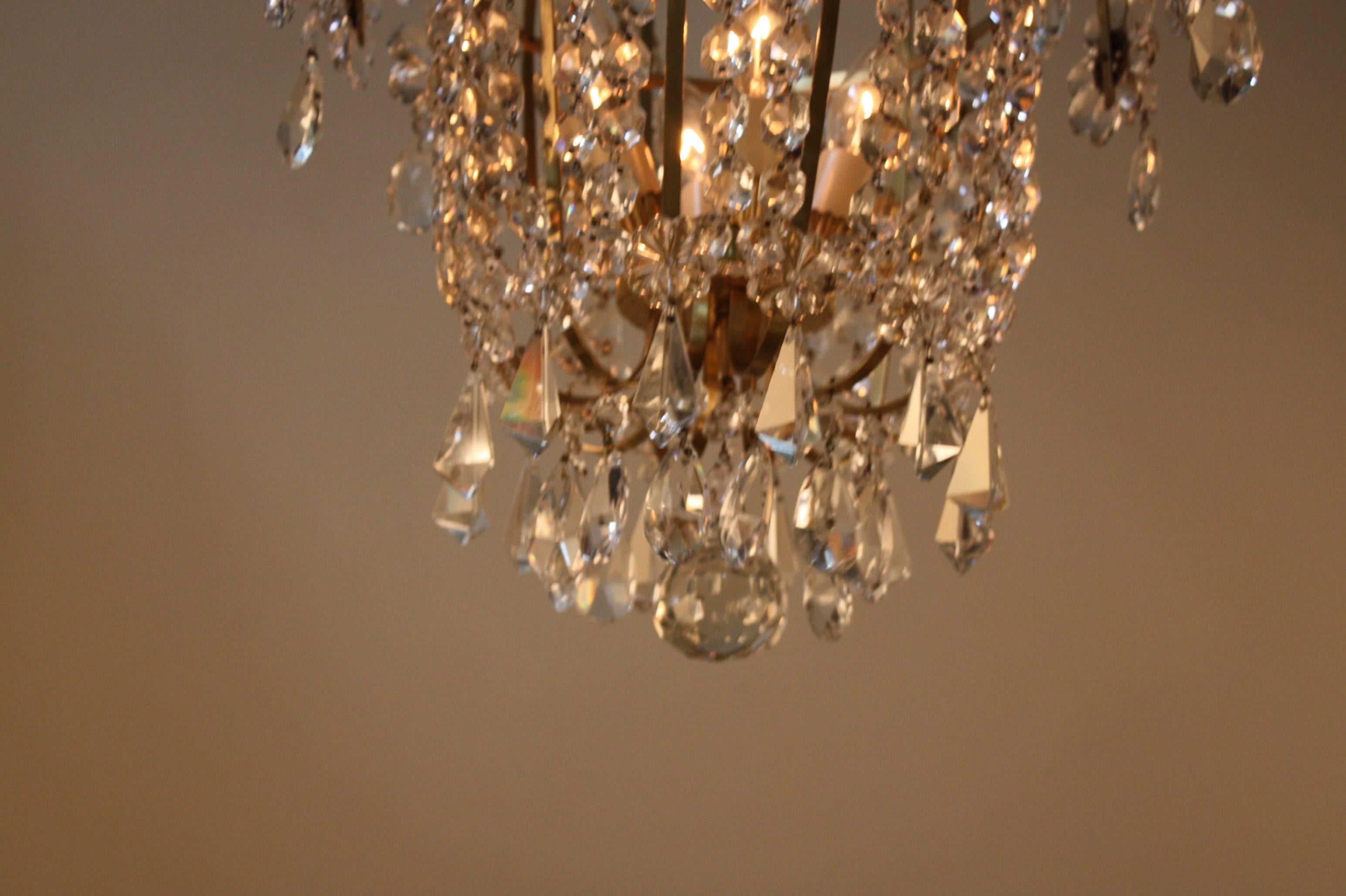 Fabulous four-light Mid-Century crystal chandelier which some crystal gathered together as a flower.