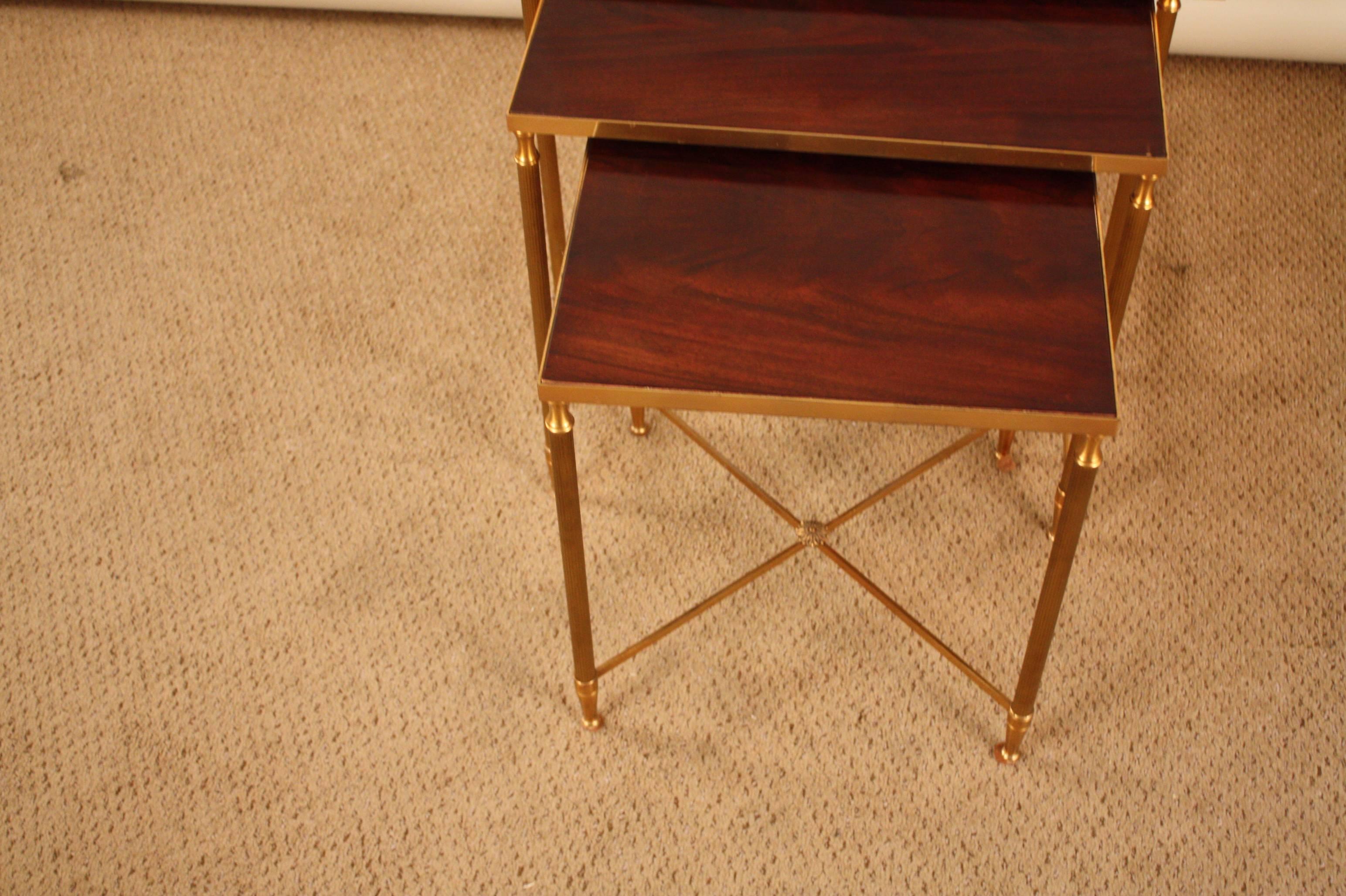 Simple but elegant set of three wood and bronze nesting tables.
Sizes:
Large 17