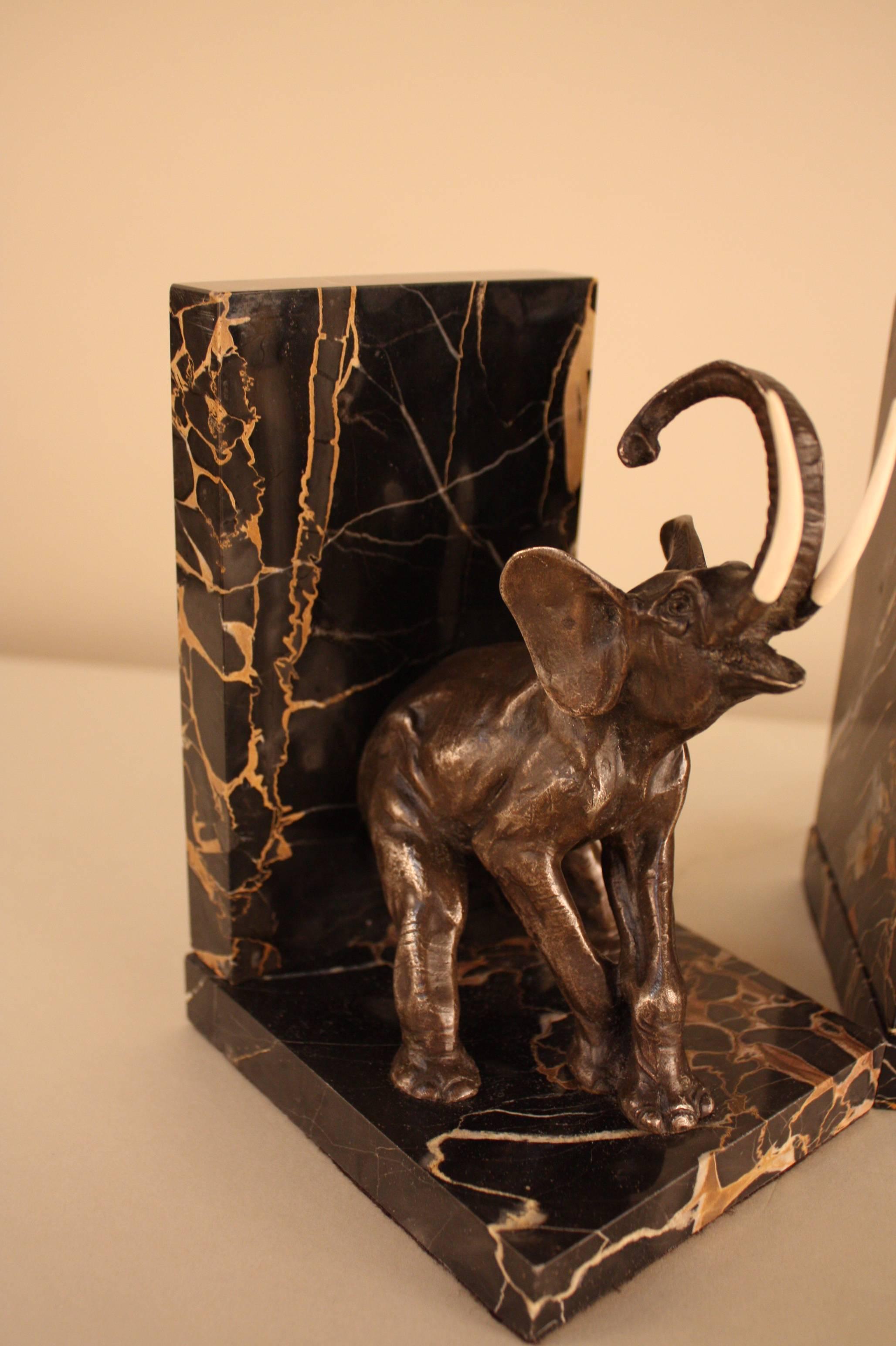 Elegant pair of French Art Deco bronze elephant and marble bookends.
