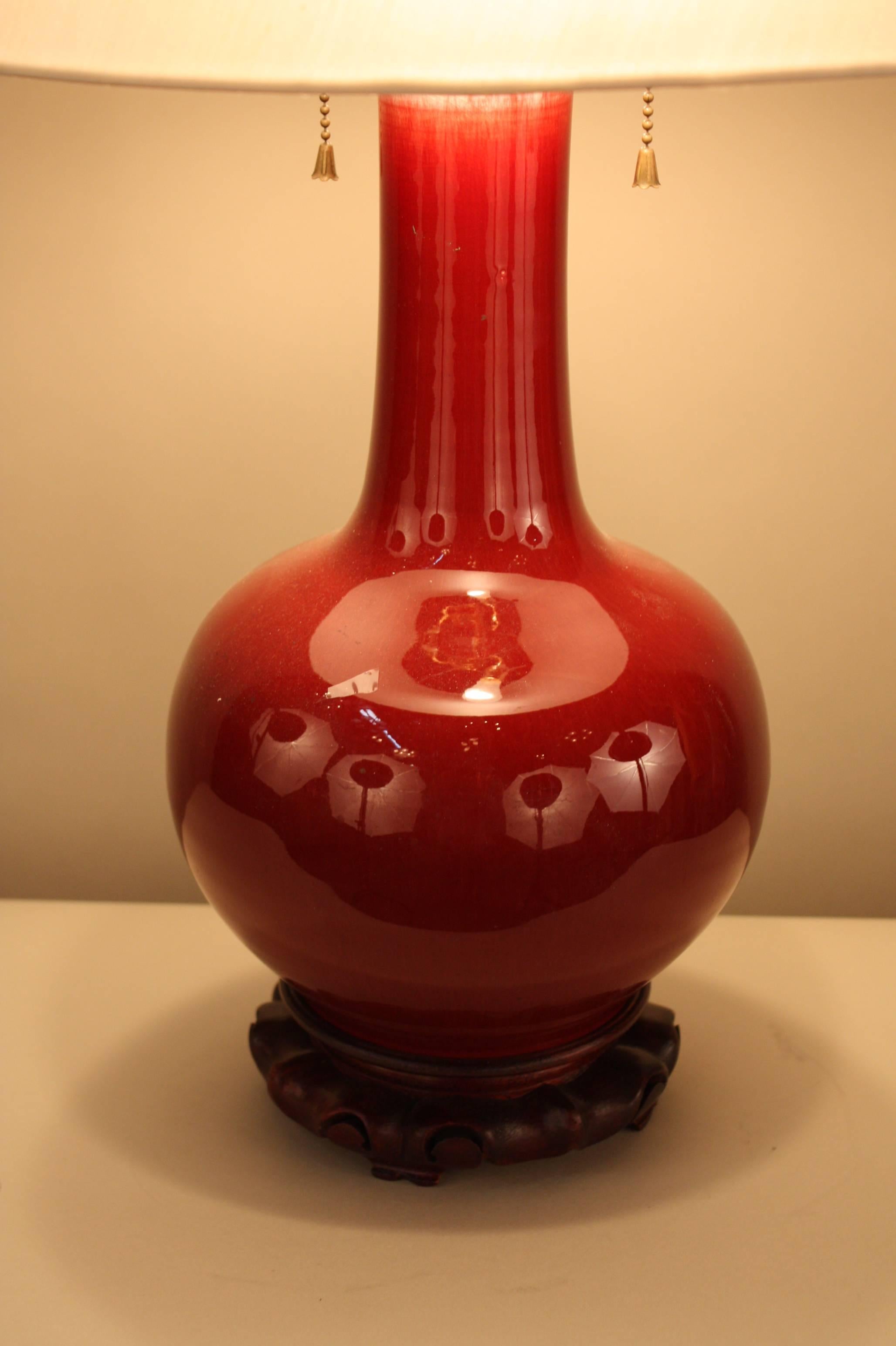 A super quality oxblood color vase that was imported to Europe from China in early 20th century which has been customized to a beautiful table lamp.