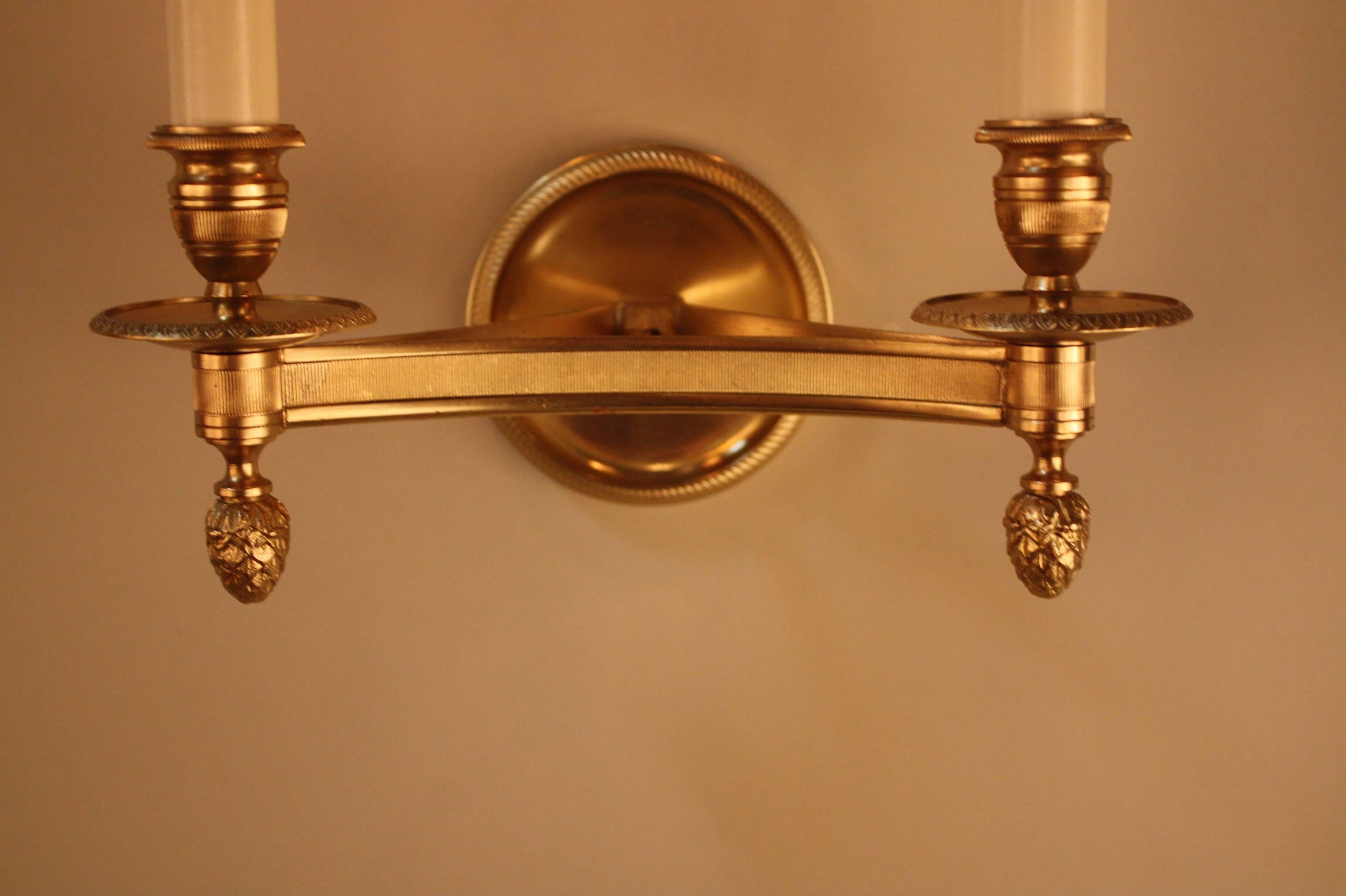 Wonderful pair of double light Classic design bronze wall sconces by Maison Charles.