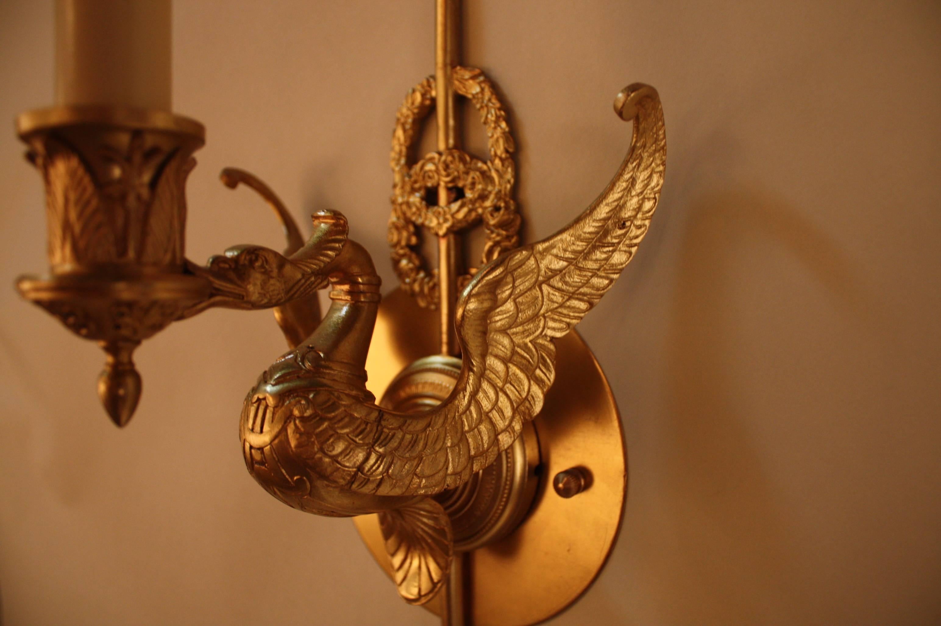 Fantastic pair of single light Empire style wall sconces. Made in France, these elegant sconces feature swan in flying motion in beautiful detail work throughout. Absolutely gorgeous.
Measurement is without lampshade.
