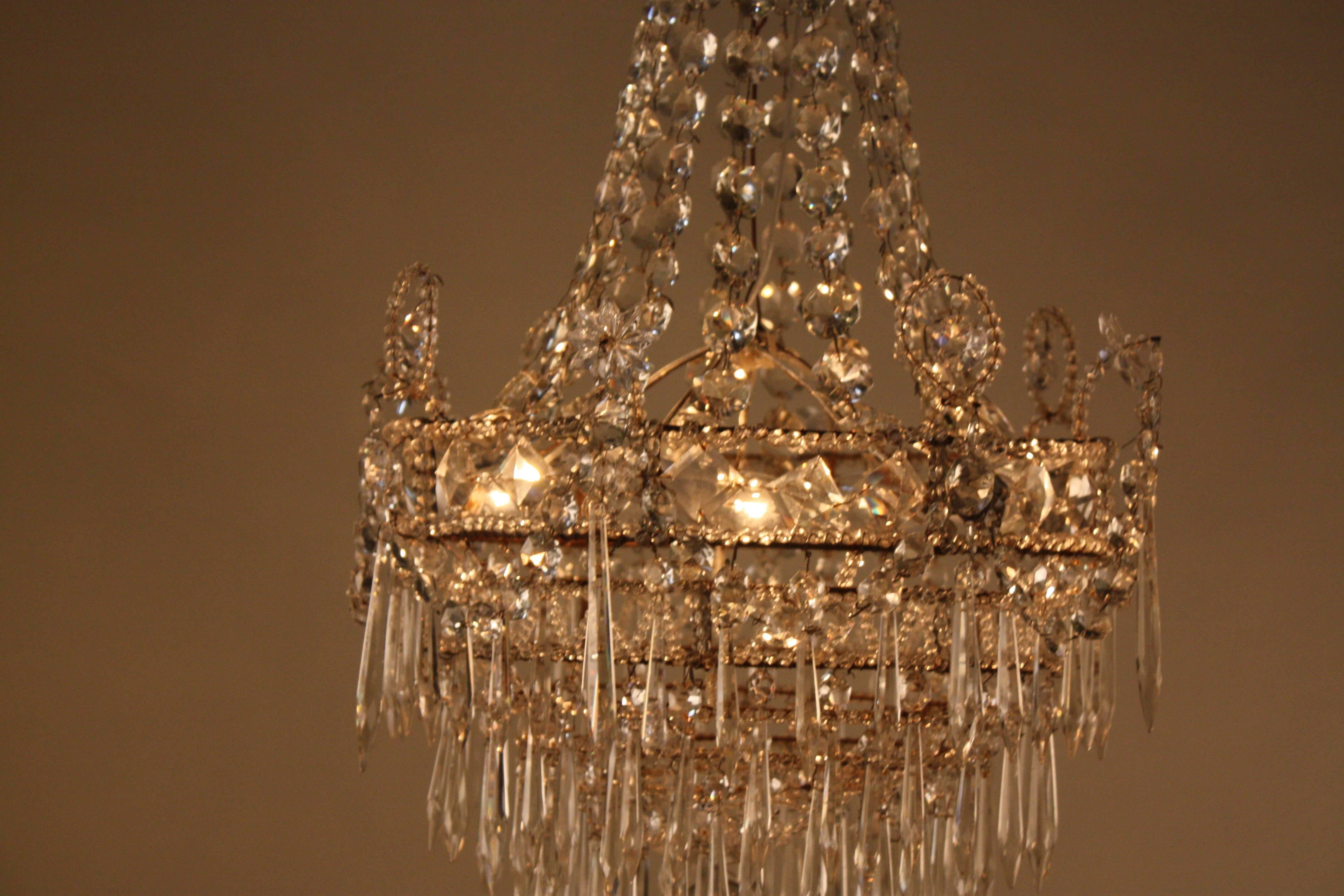 French 19th century Empire style handcrafted five-light crystal chandelier.