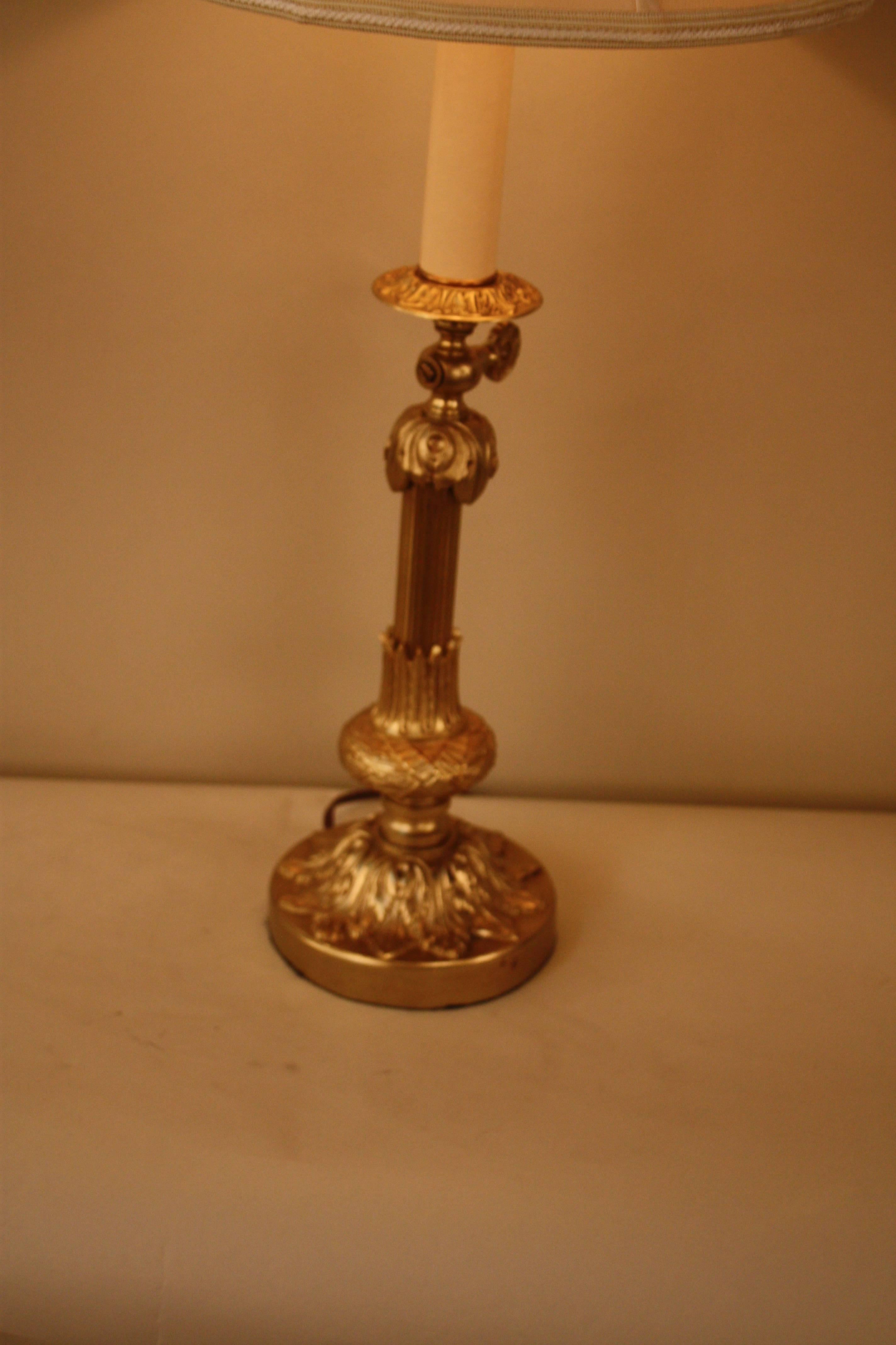 Elegant and unique 19th century bronze gas table lamp that has been electrified and fitted with silk lampshade.