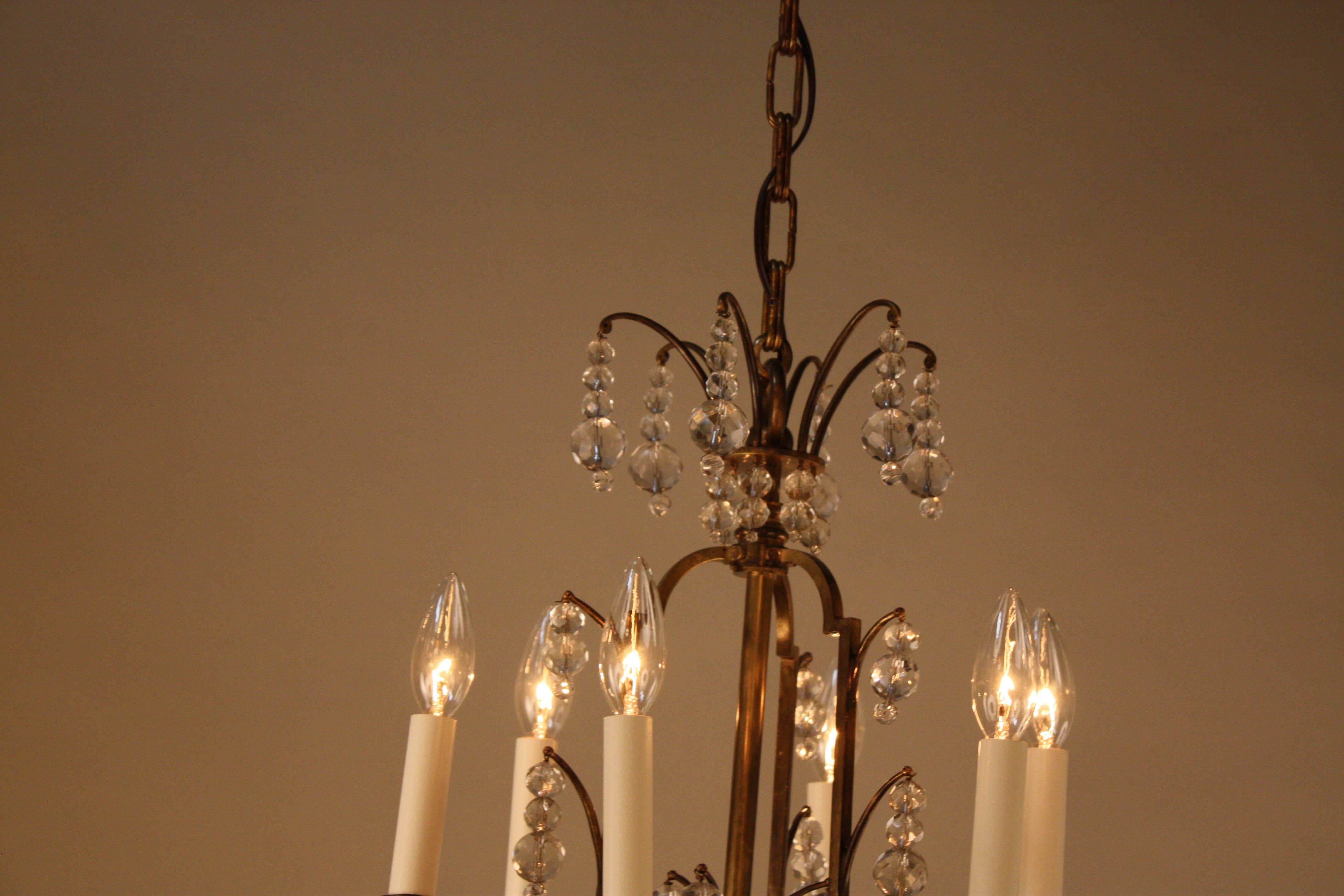 When you talk about chandeliers, you talk about jewelry for your special room and this teardrop crystal and six-light bronze chandelier will bring sparkles to any room.