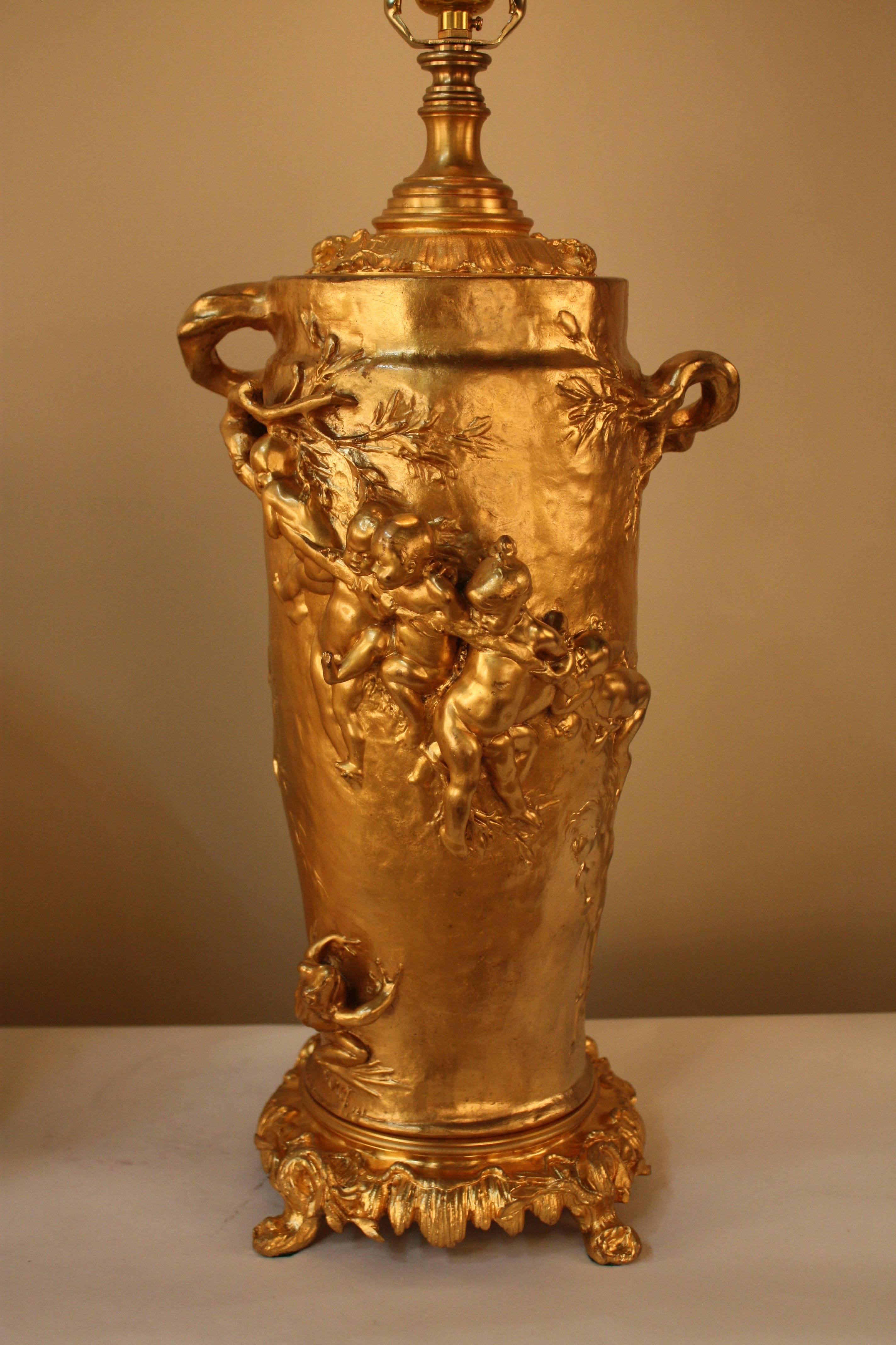Fabulous electrified 19th century doré bronze oil lamp by:
 Gustave Joseph Chéret (French, 1838–1894) (Soleau Paris foundry), important sculptor of second half of 19th century. This sculpture lamp has two tree branches as handles that diagonally