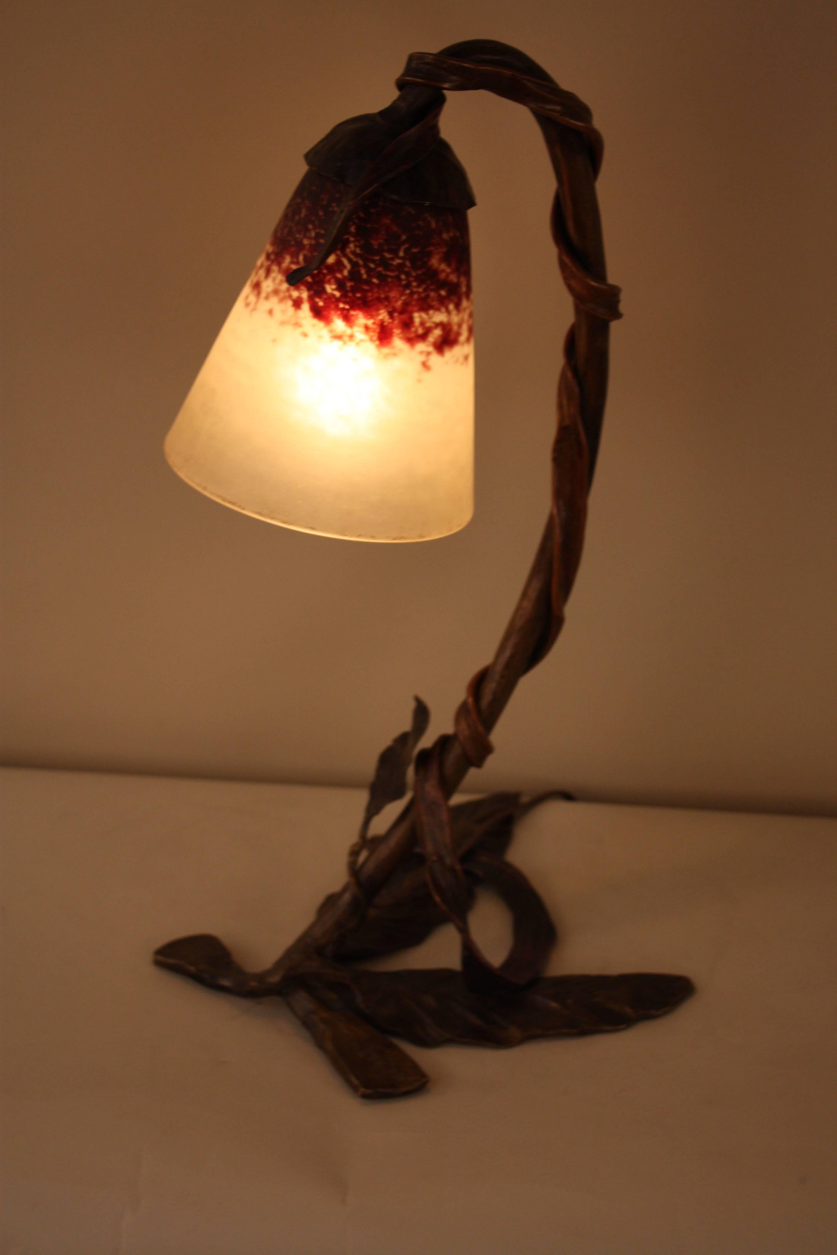 Beautiful rich color brown bronze with blown glass shade by Charles Schneider.
Art Nouveau table lamp.