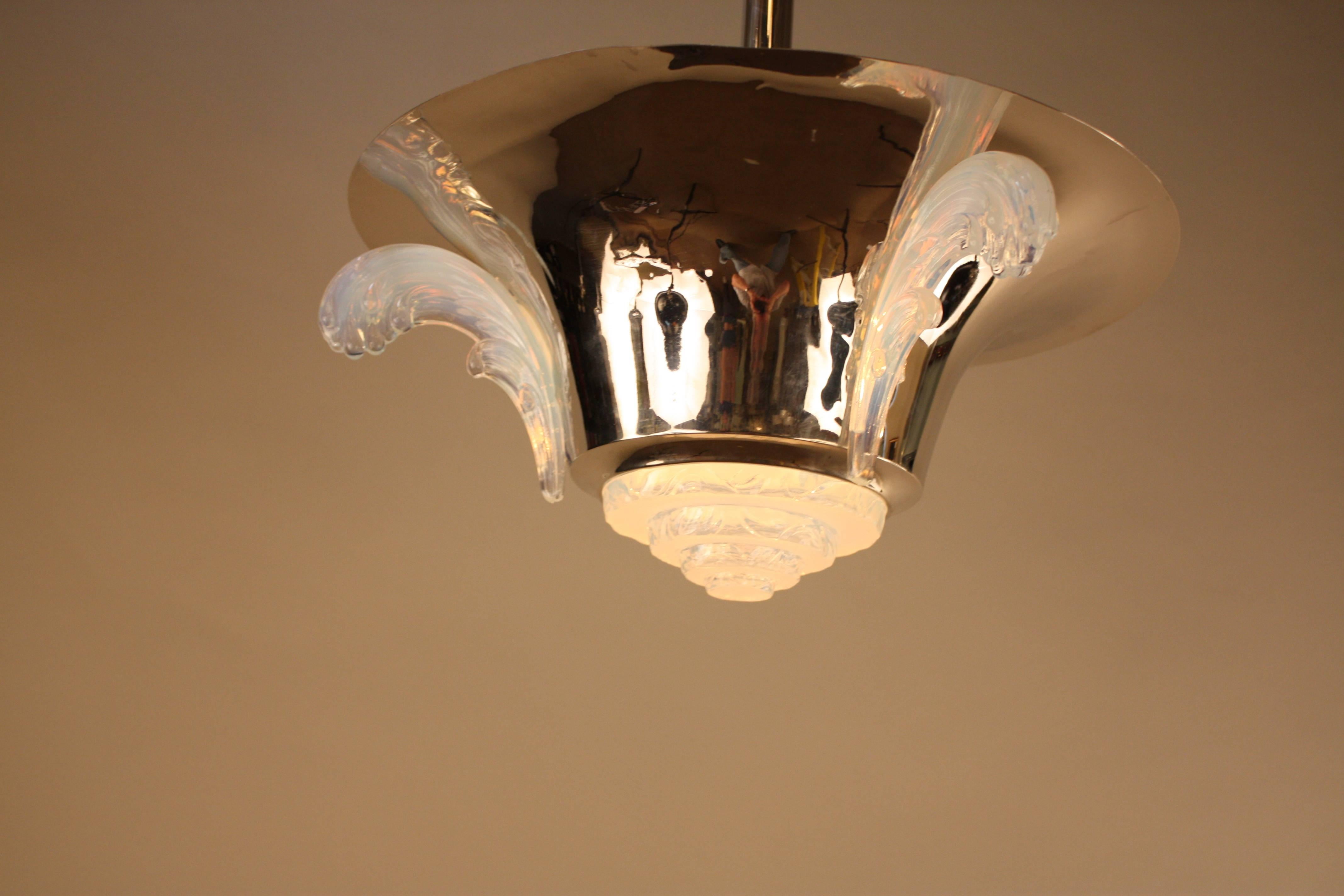 A beautiful polished nickel Art Deco chandelier with feather design opaline glass.