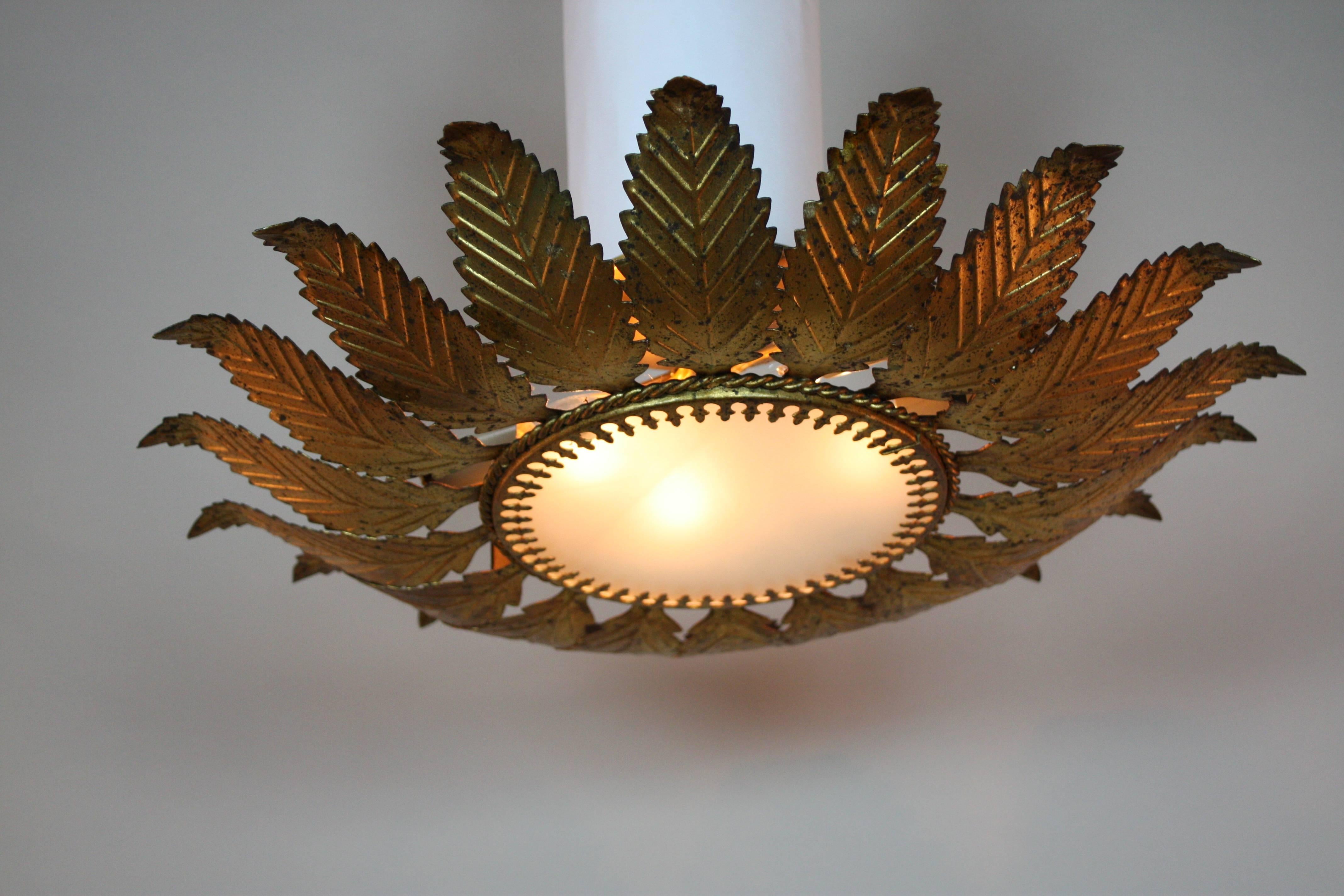 A stunning flush mounted ceiling fixture. Made in Spain during the 1950s, the Classic era for unusual art work, this fabulous piece features four lights and an elegant floral inspired design. A beautiful combination of art and craftsmanship, this