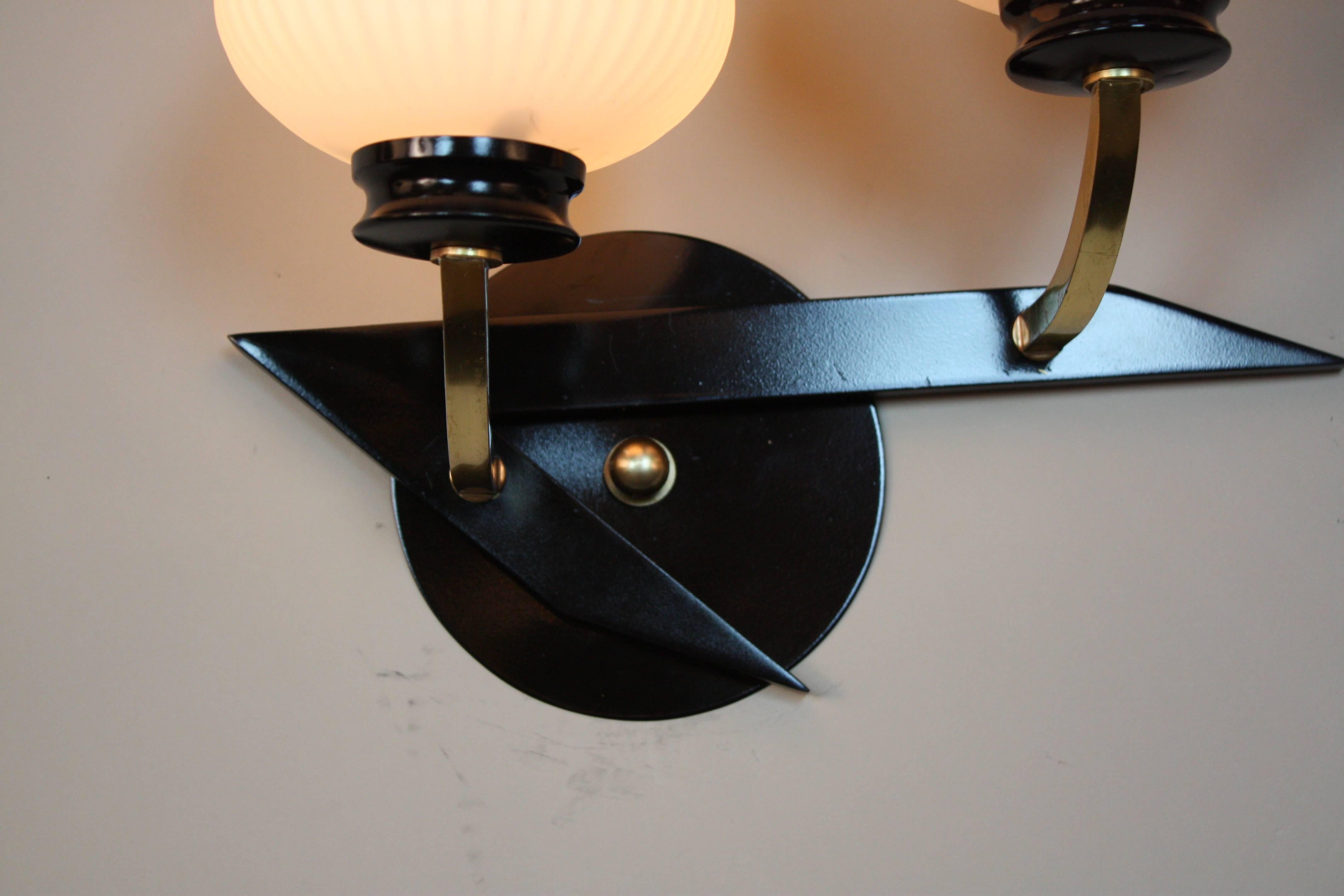 Pair of double light with tulip glass shade bronze and black lacquer wall sconces.