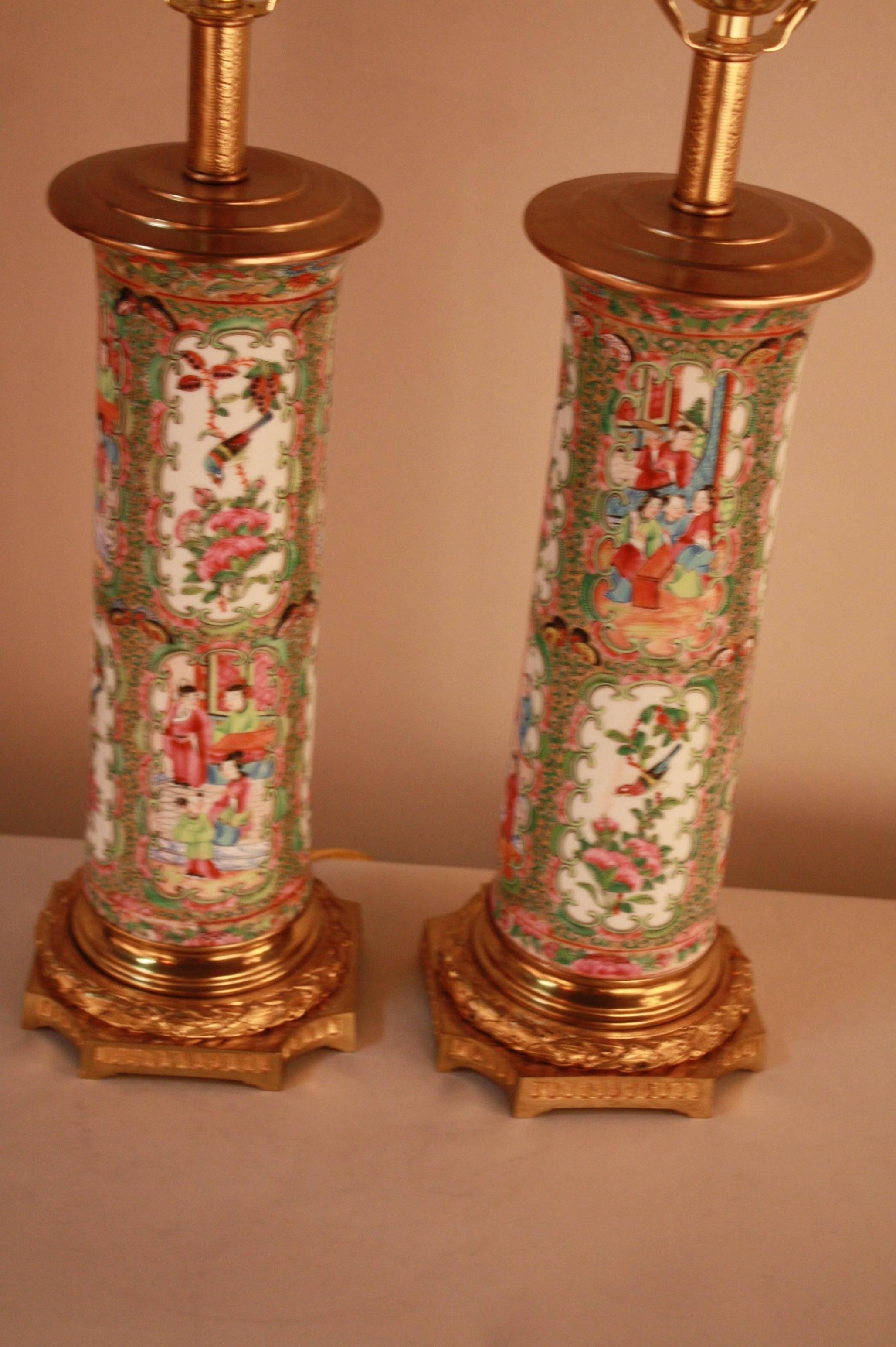 Pair of 19th century hand-painted rose medallion imported porcelain vases that have been mounted with French bronze bases.
These lamps are fitted with silk lampshades.