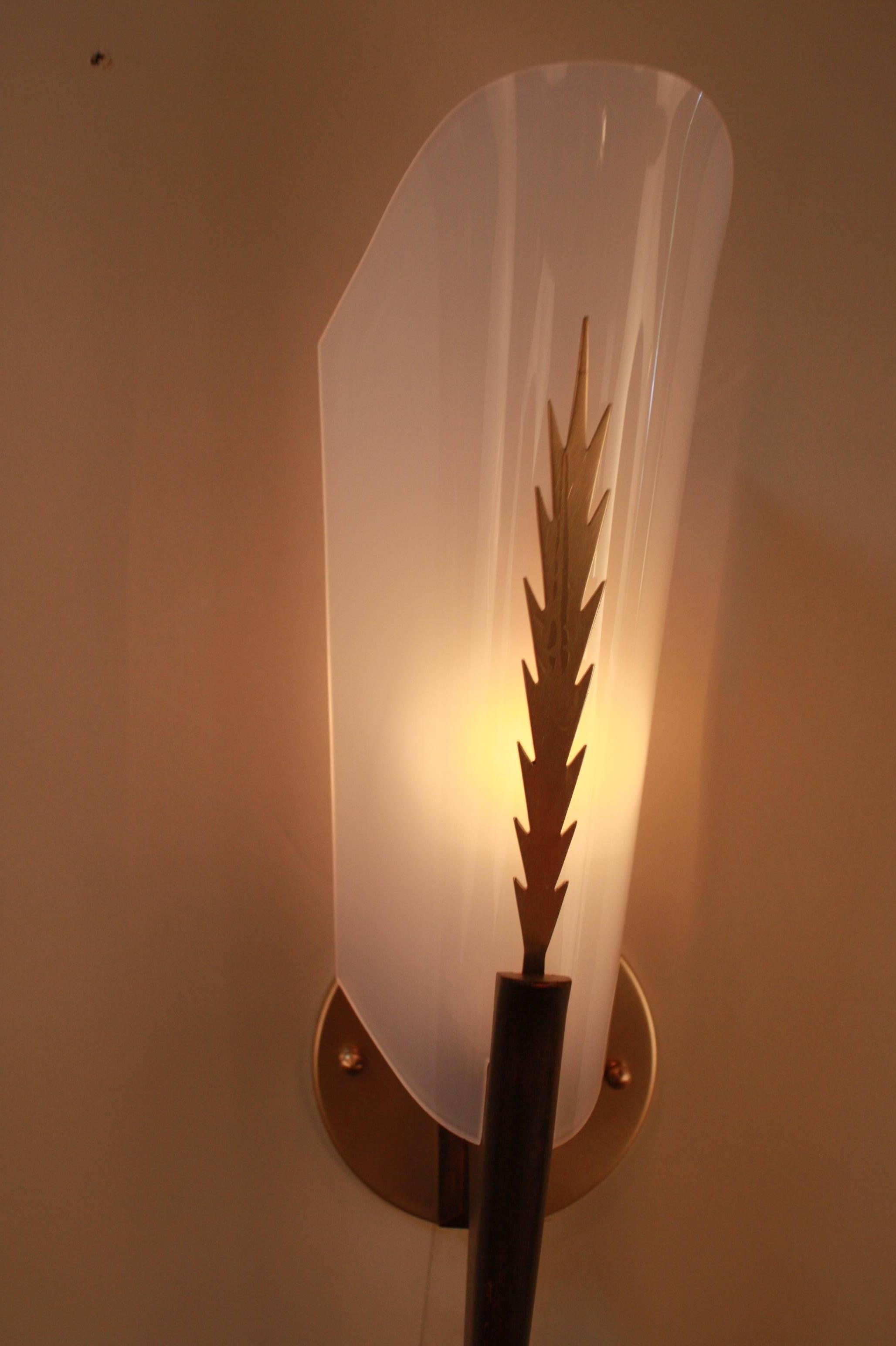 A fabulous pair of Lucite and wood wall sconces with bronze decoration.