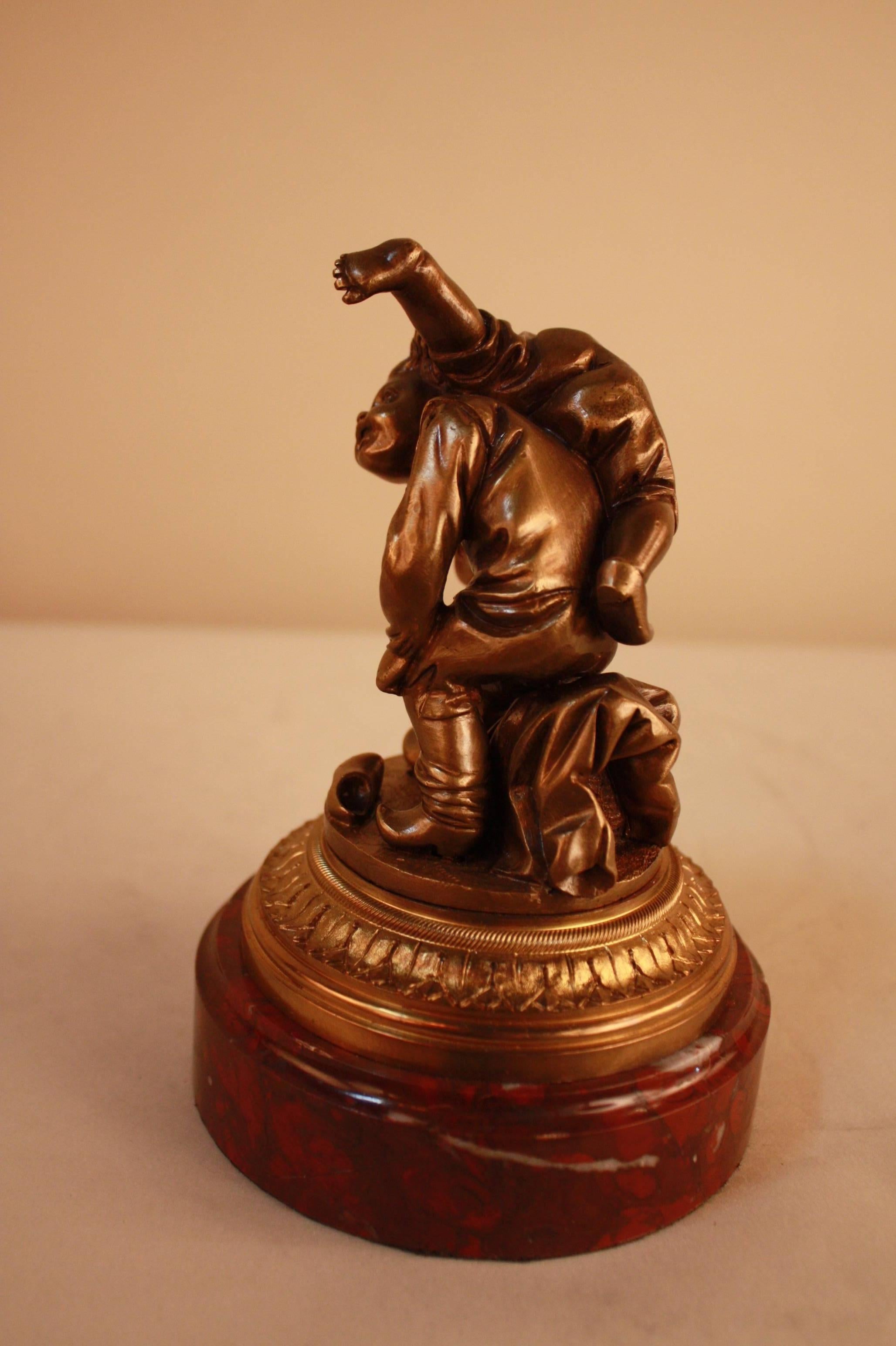Beautiful Dutch bronze. Children playing and laughing on red marble.