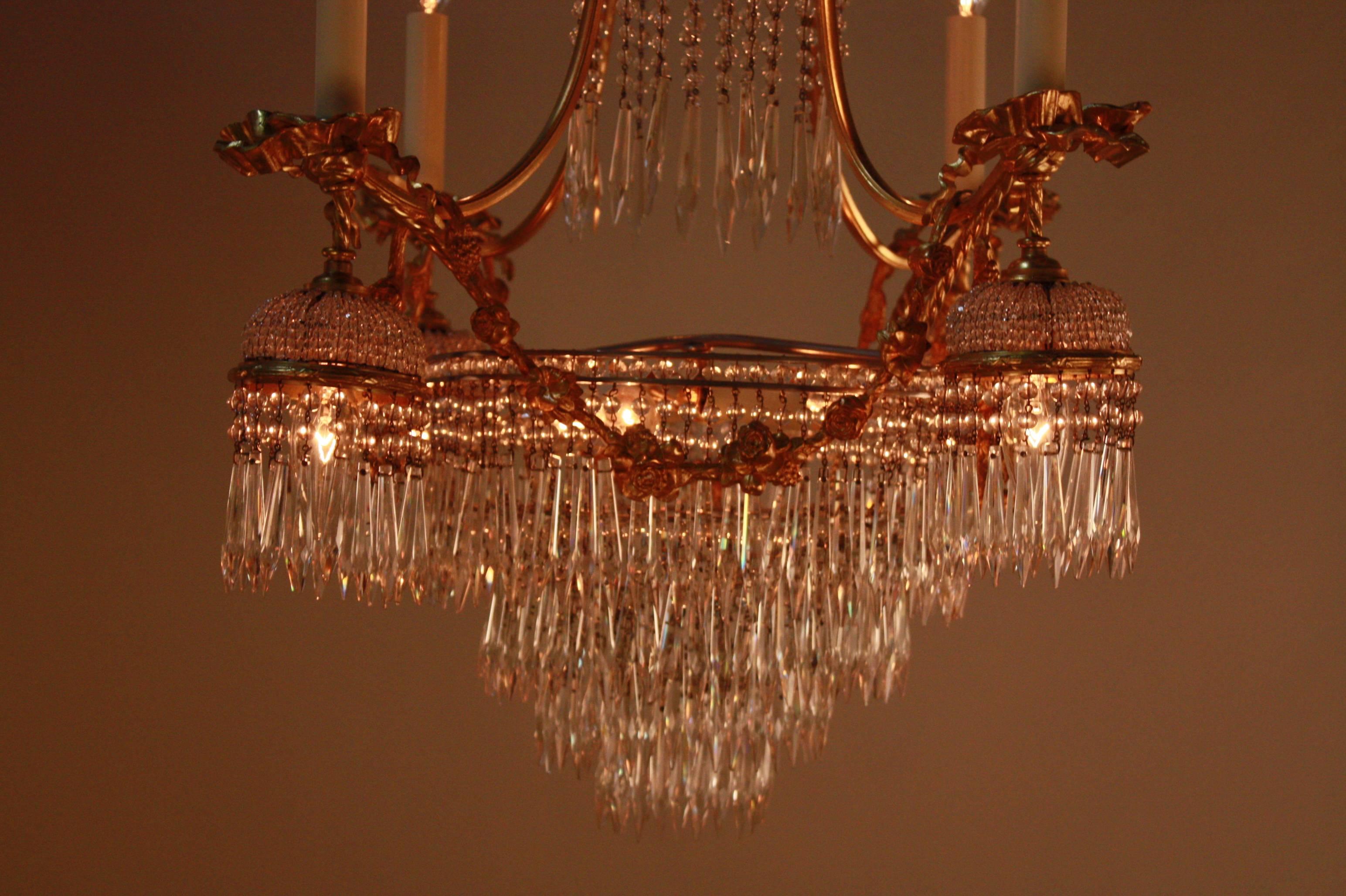 A superb bronze doré and crystal chandelier. Handcrafted beaded baskets with high quality sparkling crystals and elegant design doré bronze frame makes this chandelier very unique. Total of 13 lights.