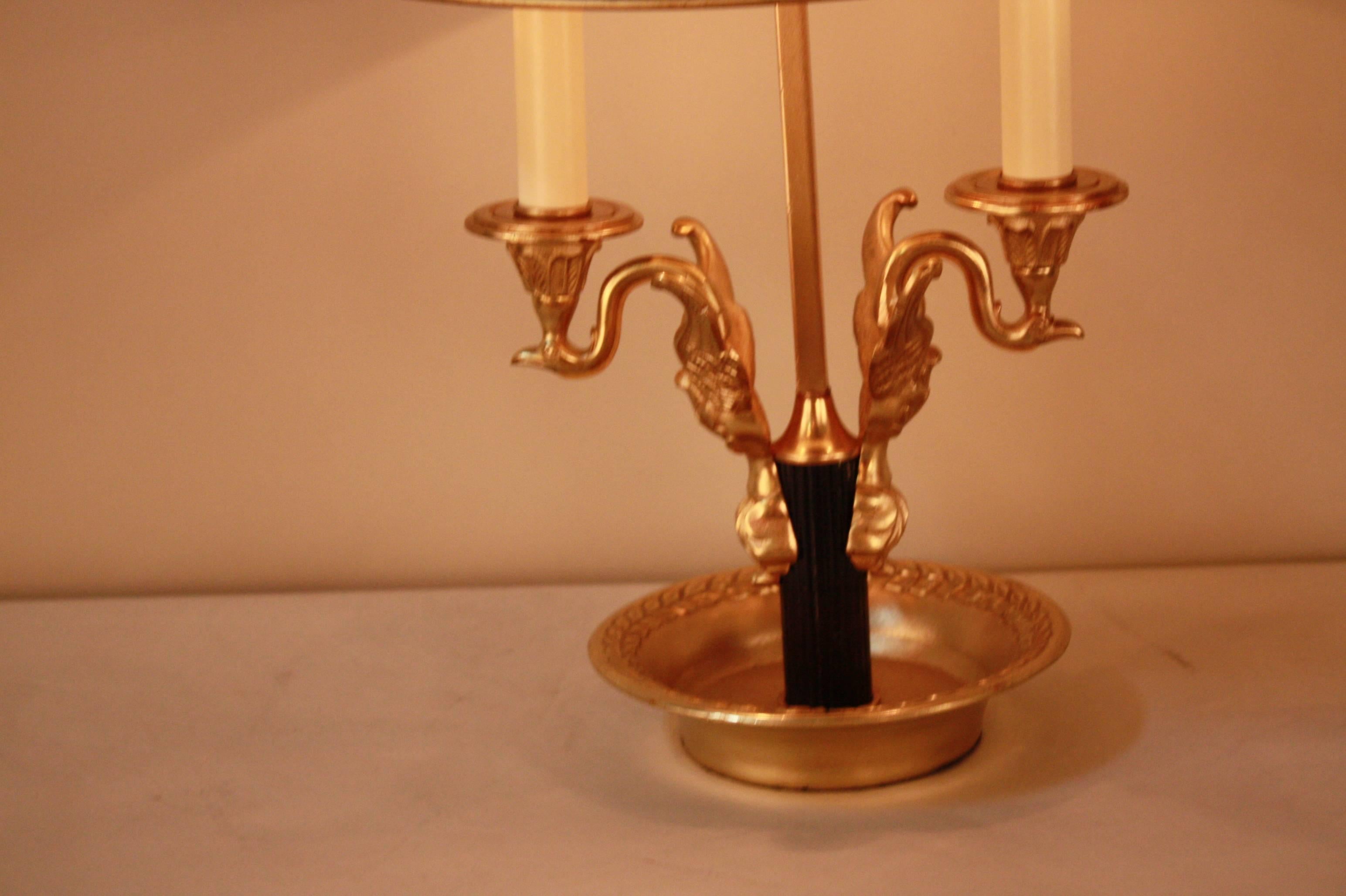 French Empire style double arm bronze and tole swan-arm bouillotte lamp with adjustable height shade.