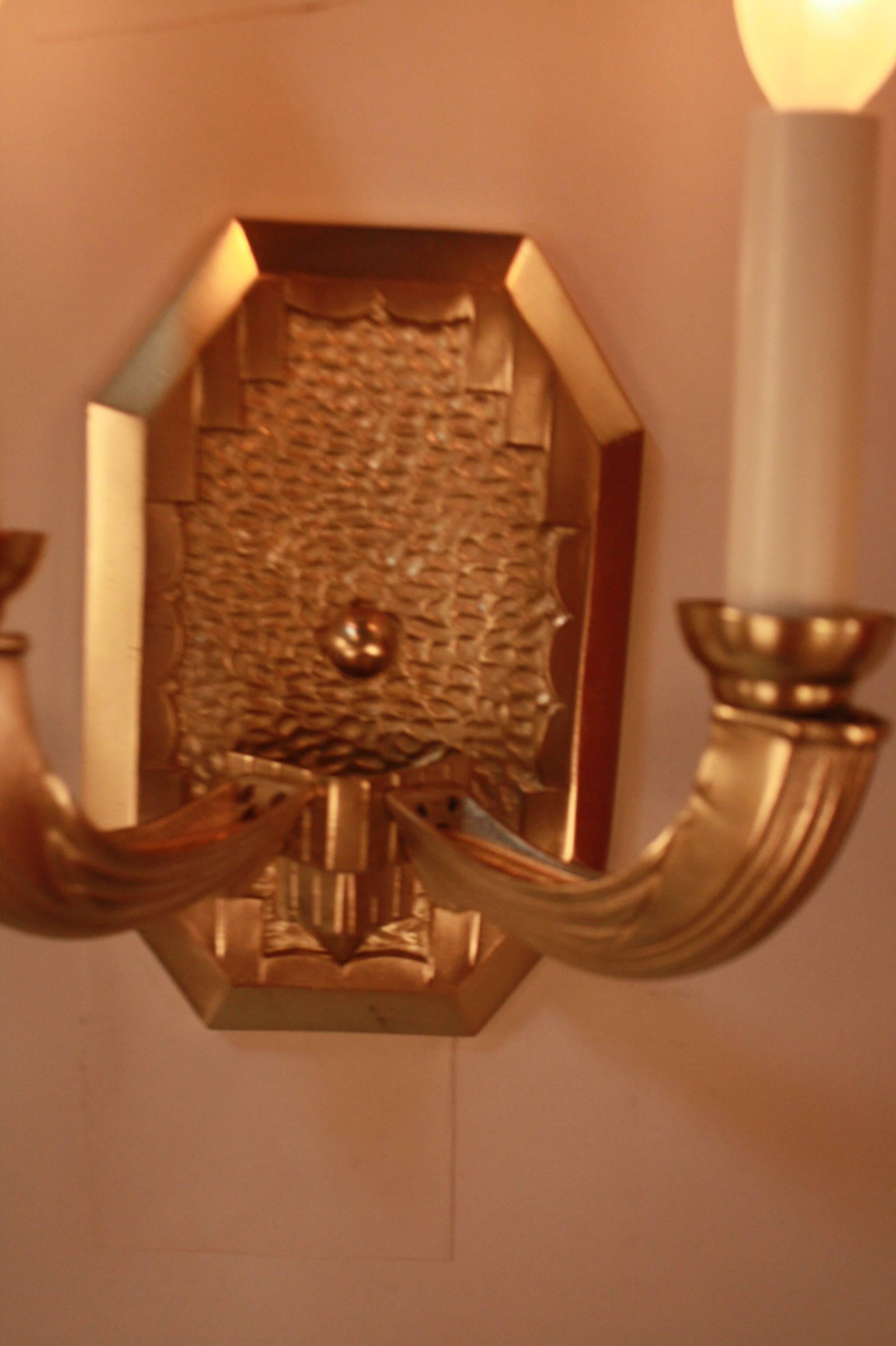 Set of four double arm French Art Deco bronze wall sconces.
Sold in pair only.