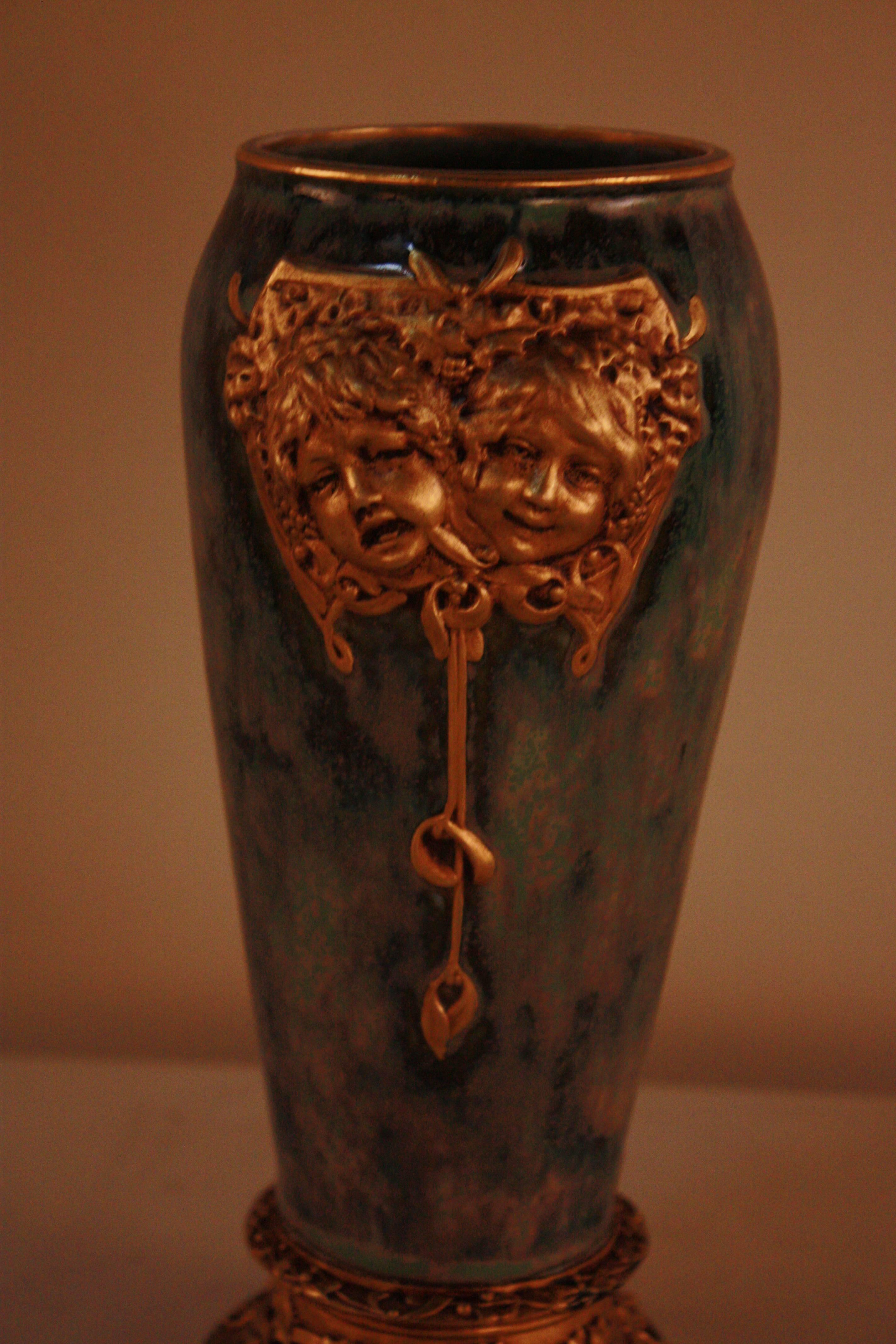 Multi-color glazed porcelain vase mounted on doré bronze base by Paul Louchet, Paris. Note the artist seal on the rear of this piece, seen in image six, as well as the detail in the glaze. 