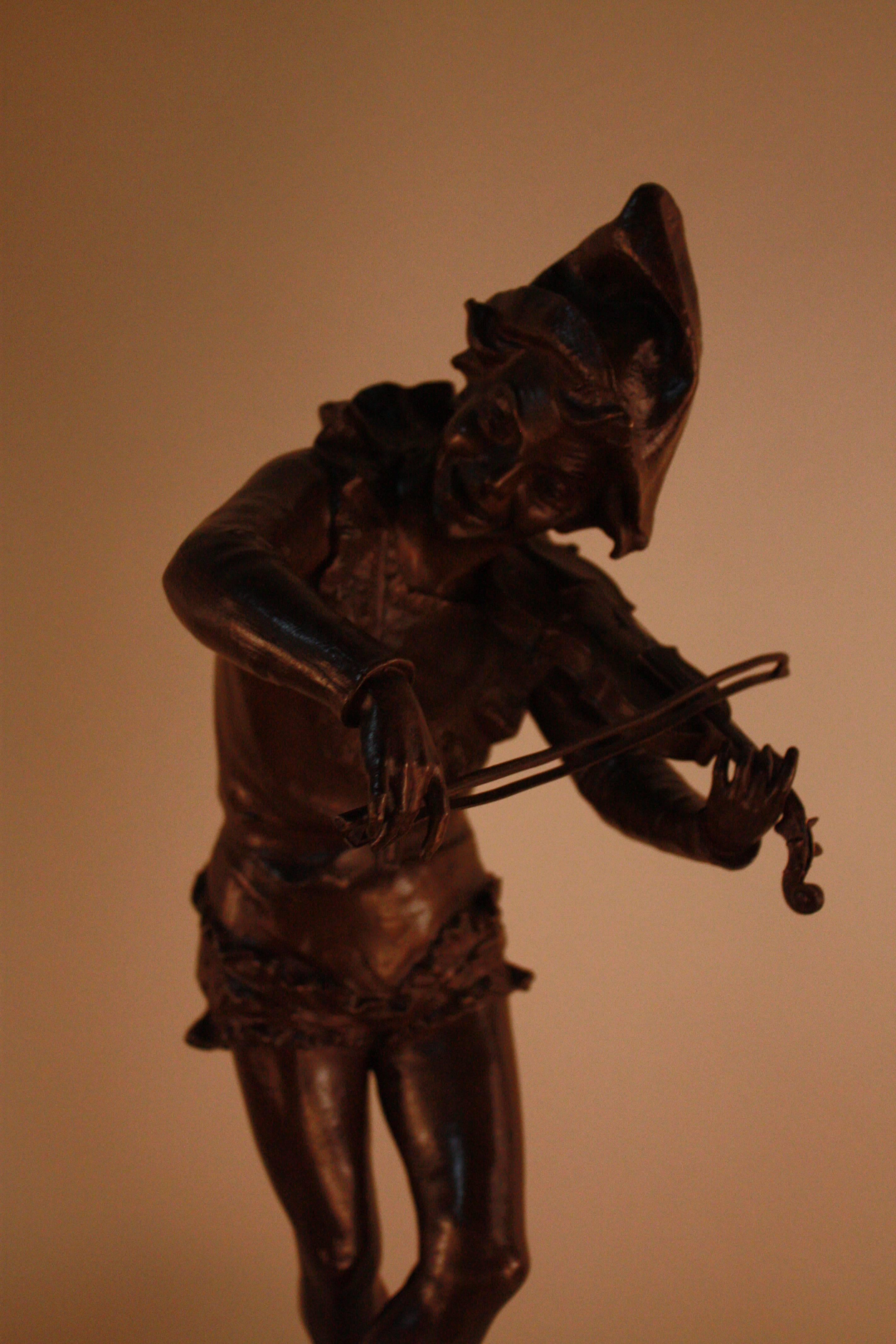 Brown patina bronze sculpture of harlequin violinist by Jules Weyns.
Fantastic subject with great detail.
