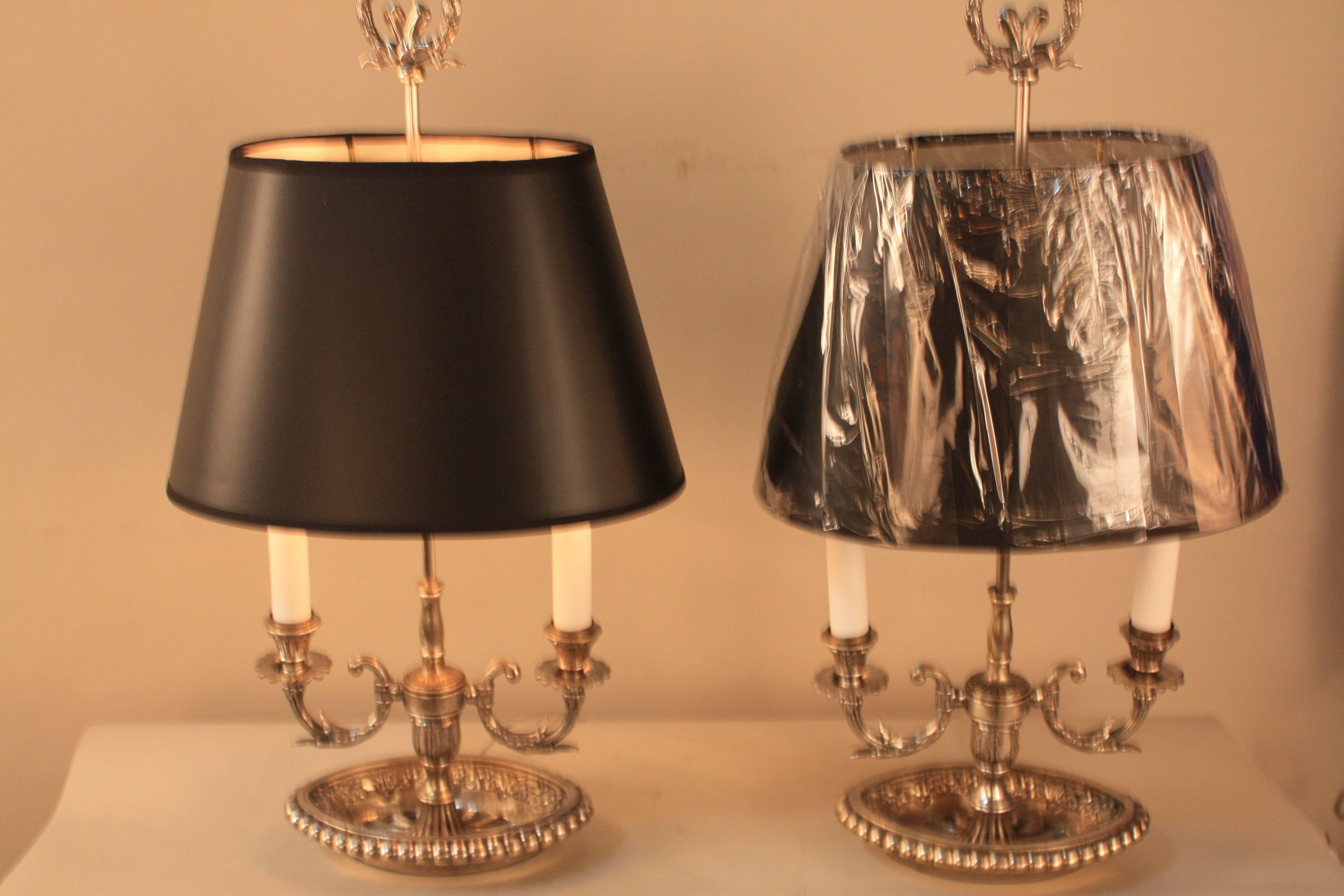 Wonderful pair of silver or nickel on bronze double light table lamps with black hardback lampshade.