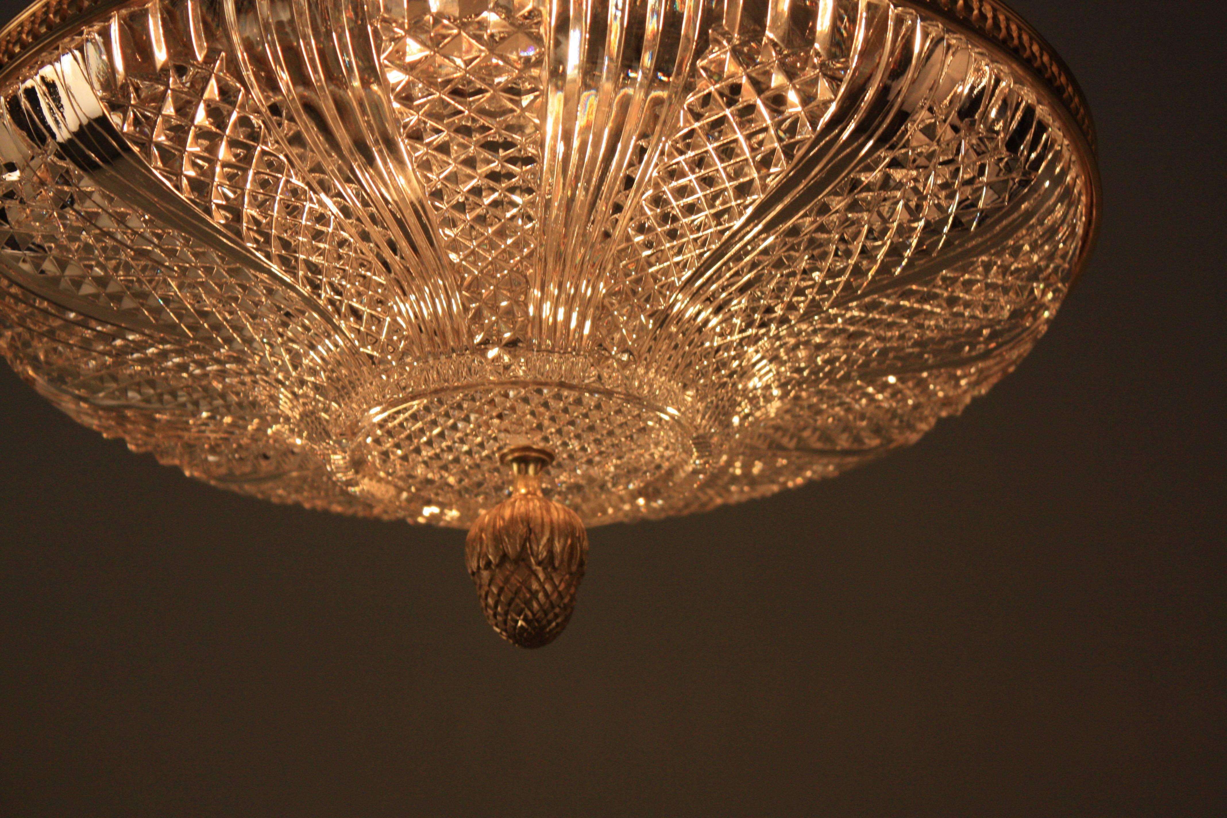 Elegant prismatic cut crystal flush mount ceiling light with bronze trim.
Total of four light 60watt each.