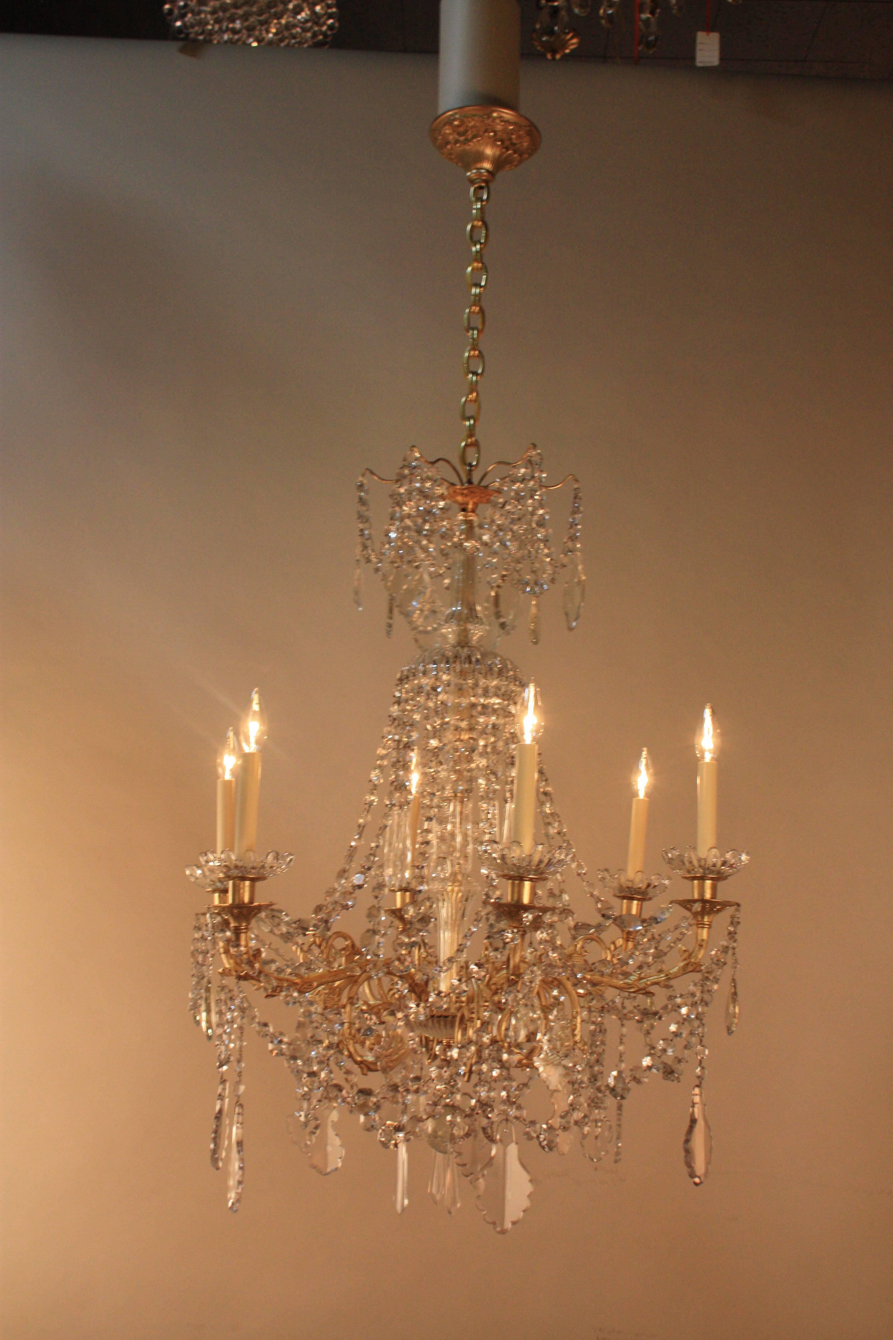 A stunning 19th century French six-light Baccarat crystal and bronze chandelier. This elegant chandelier was candle burning that has been electrified.
Measures: Total body height 37