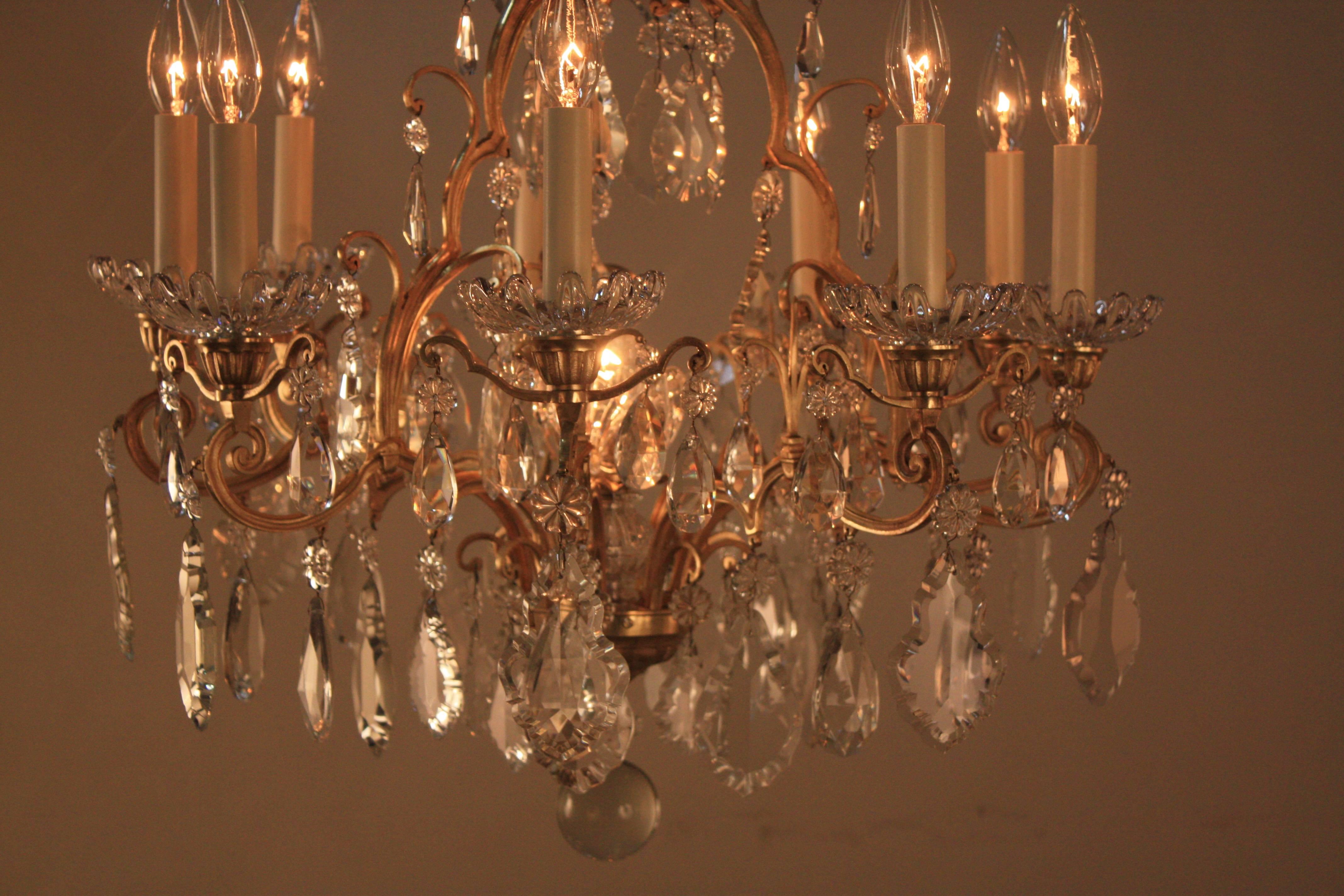 Pair high quality hand polish crystal with beautiful bronze frame chandeliers by Baccarat.
Total of ten lights 60 watt each.