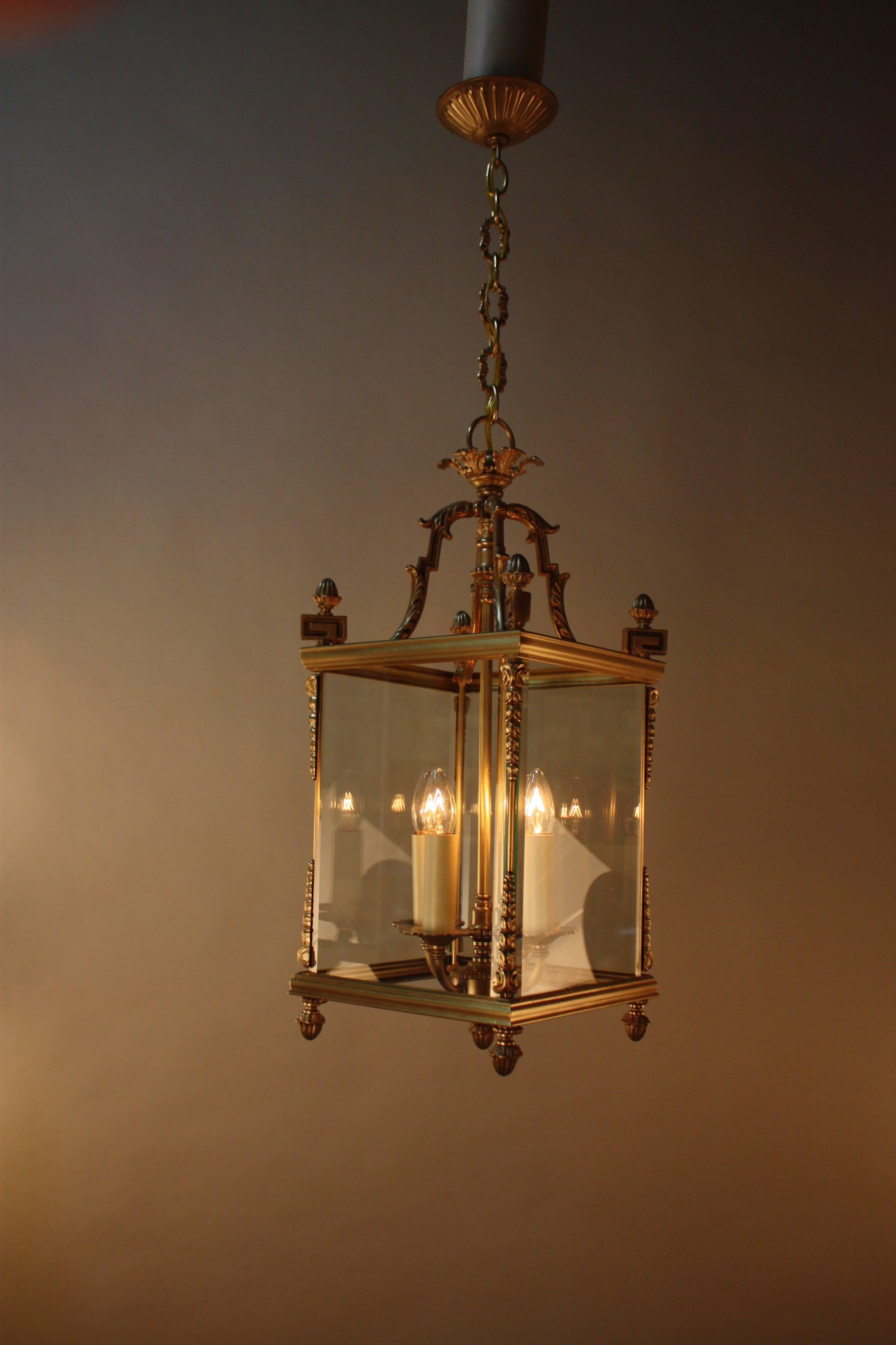 Elegant pair of four-light square bronze lanterns with beveled glass panels.
Fully installed with one link of chain and canopy is 32