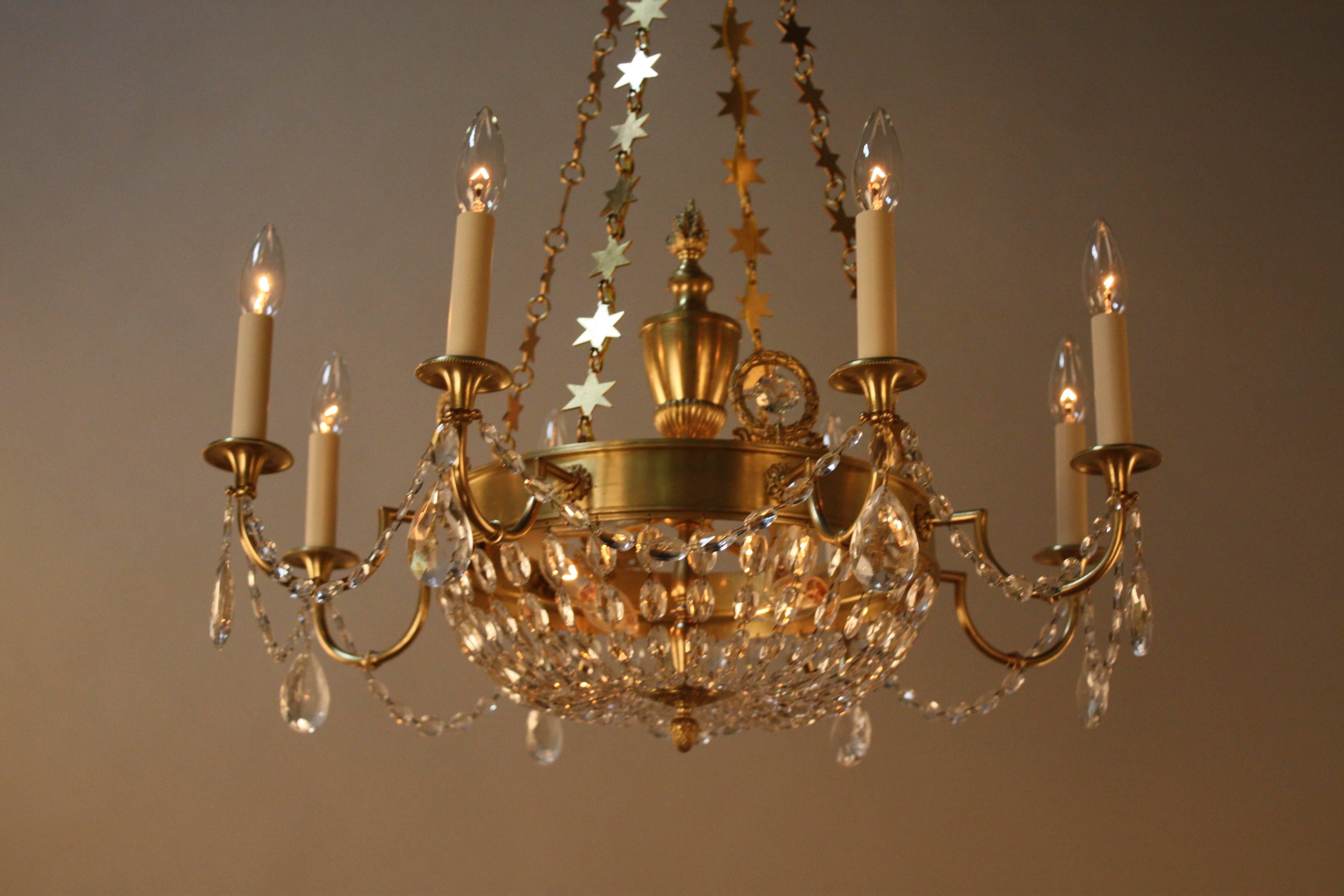 An early 20th century Empire style French bronze and crystal chandelier.
Twelve -light 60watt max each.