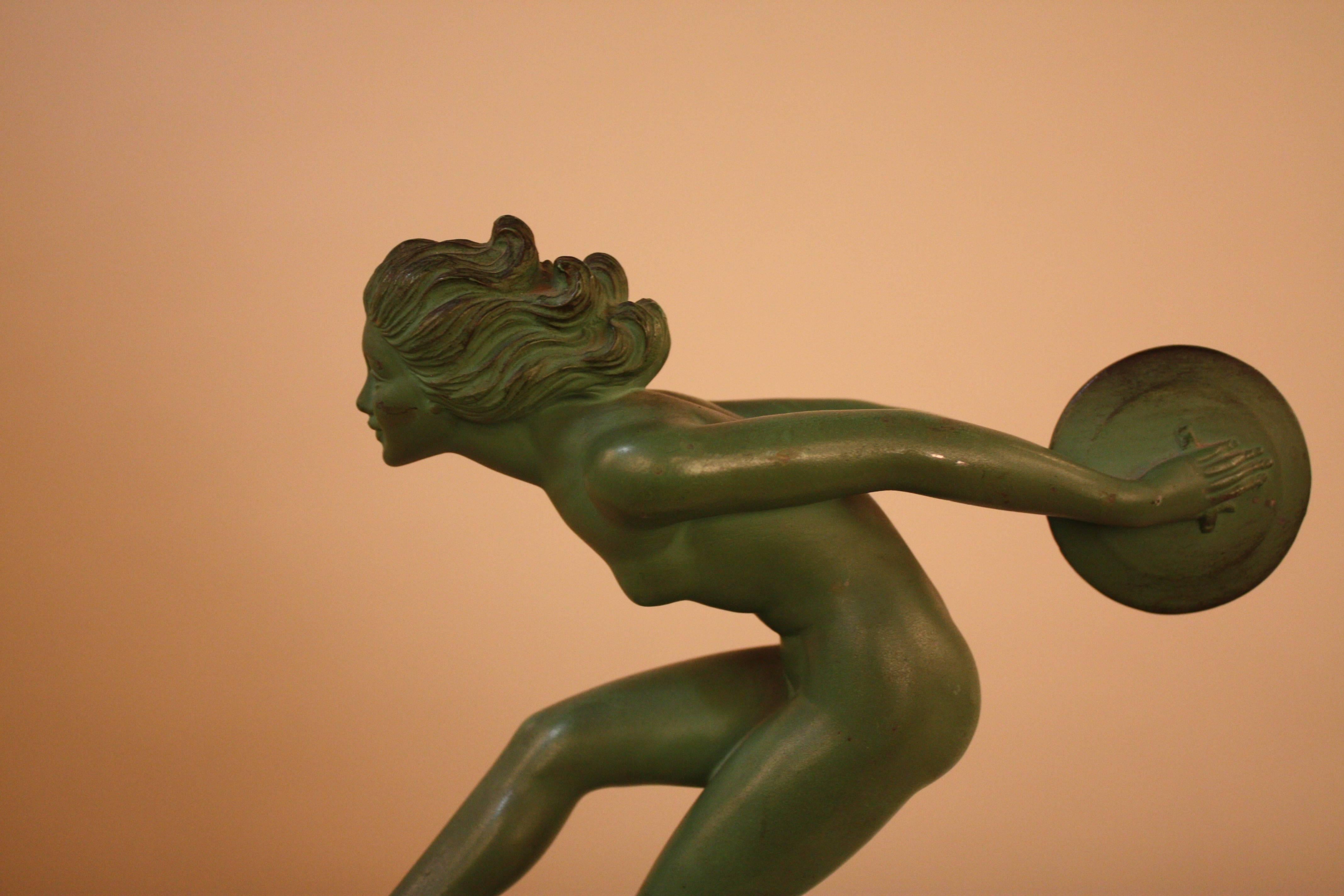 Fabulous Art Deco female nude disc dancer in green patina finish sculpture.