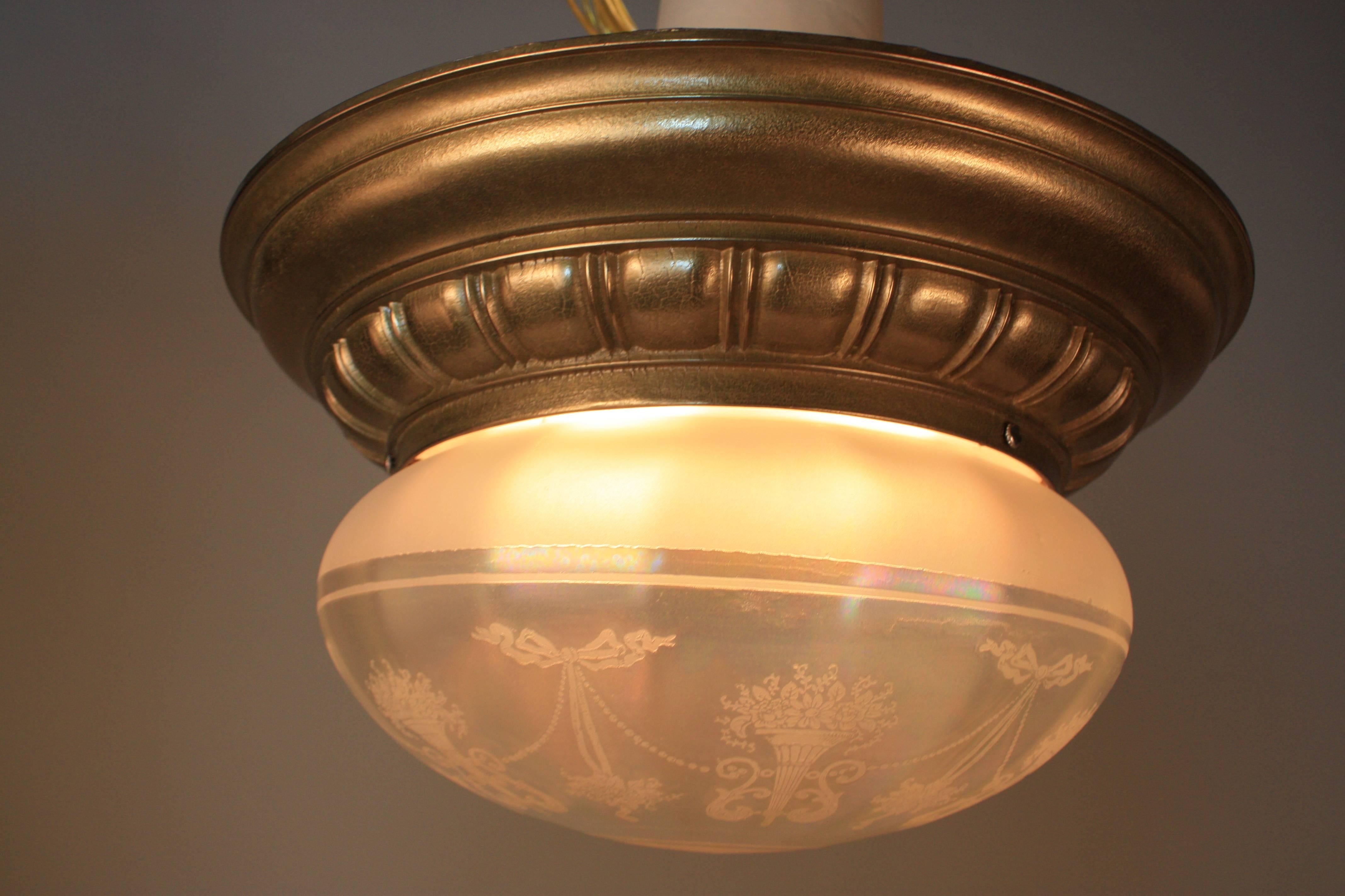 A fabulous cased brass flush mount American chandelier with acid etched glass shade.
Total four lights 60 watts each.