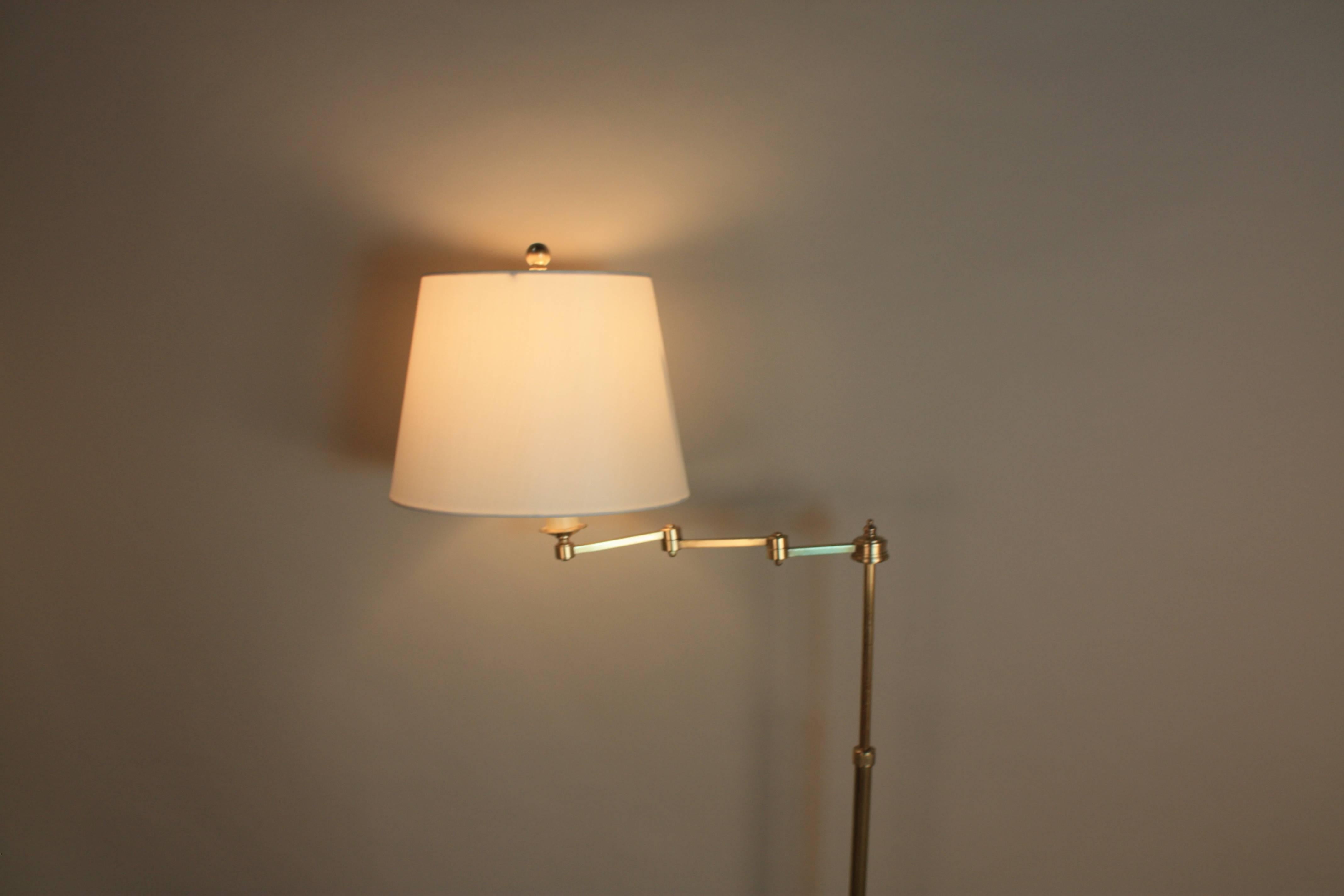 Simple but elegant French bronze swing arm adjustable height floor lamp by Maison Baguès.
Fitted with hardback silk lampshades.
 