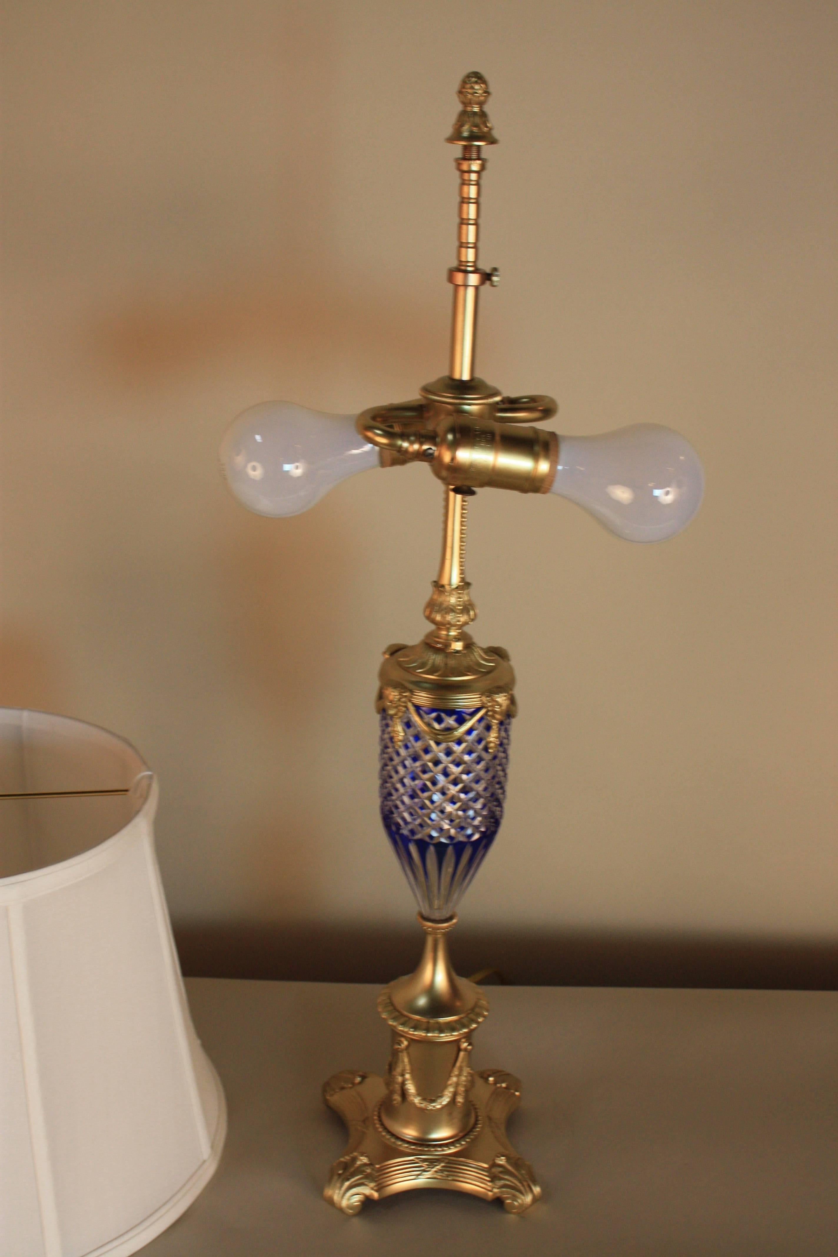 Blue wit clear cut crystal mounted on bronze with double socket and handmade silk lampshade.